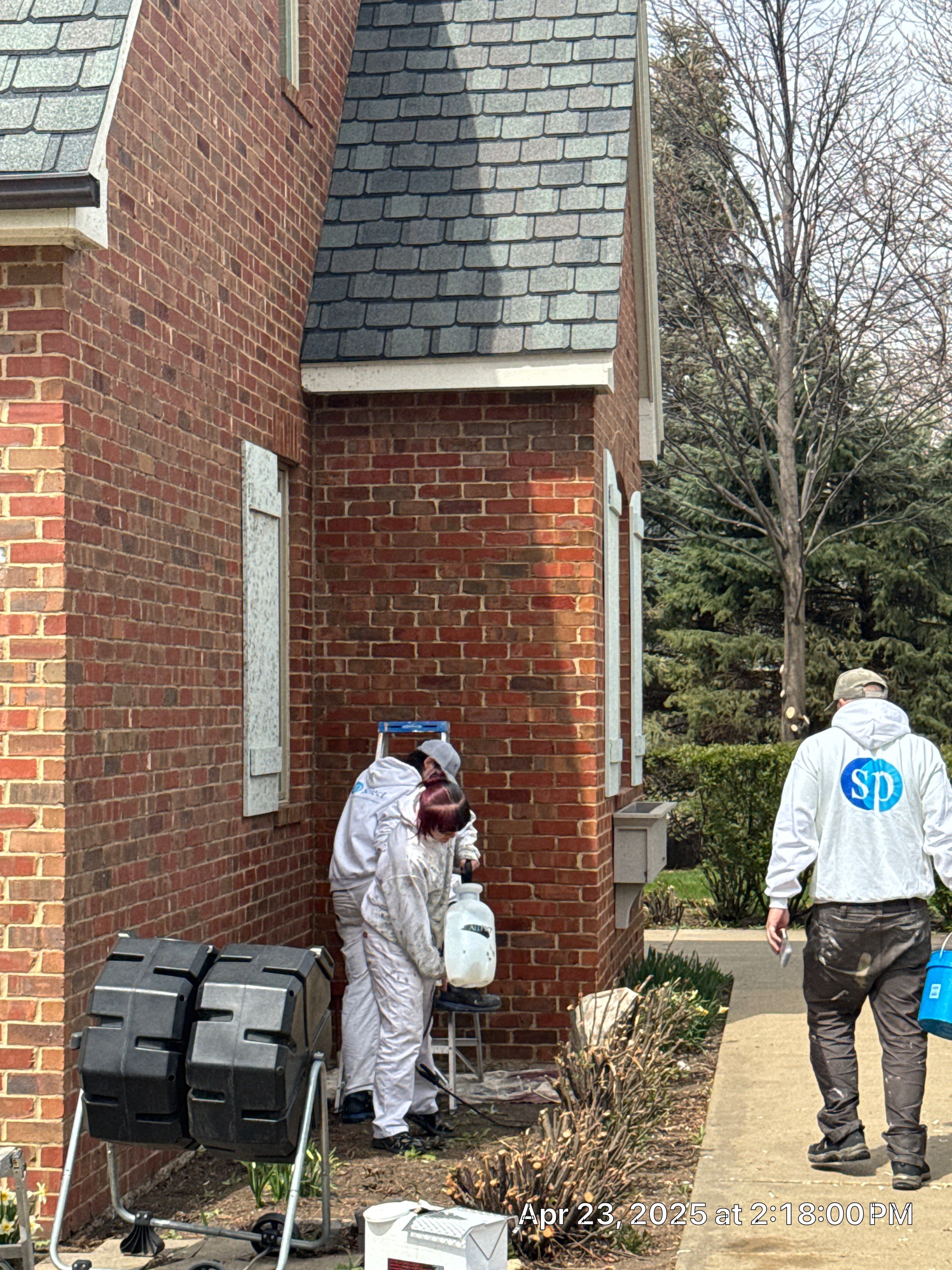 Residential Exterior Brick Painting and Limewash Refresh in Sioux Falls by Select Painting, Coatings & Garage Cabinets