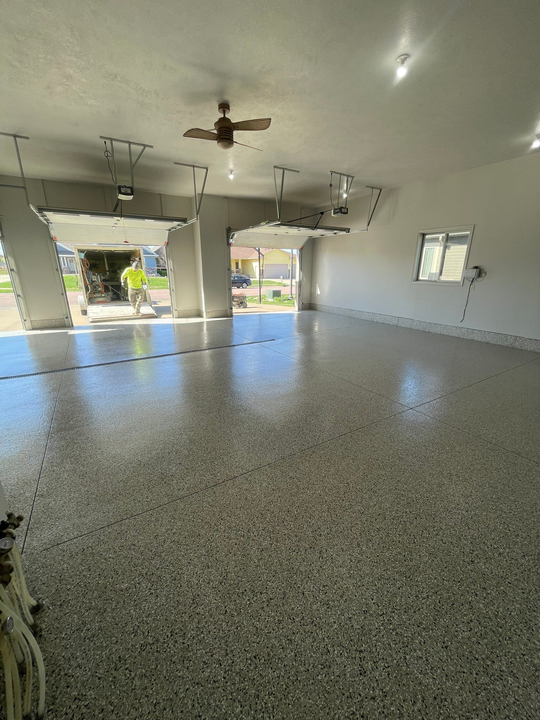 Multi-Car Garage Epoxy Floor Coating in Beresford by Select Painting, Coatings & Garage Cabinets