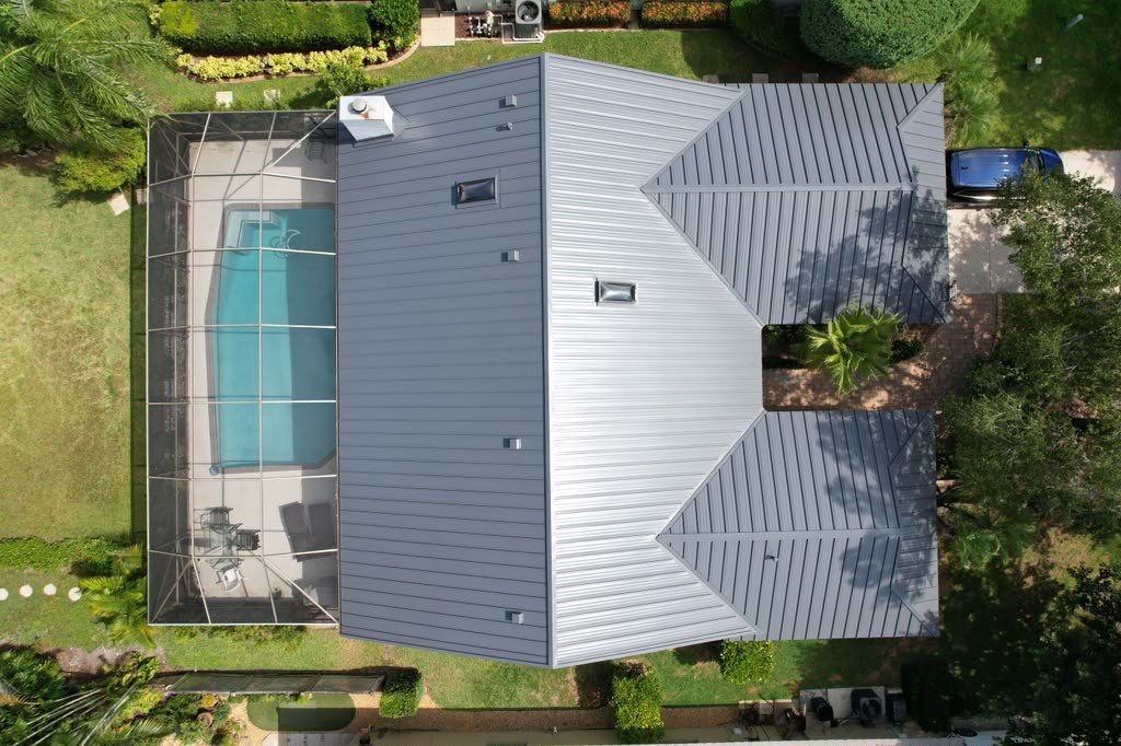 Standing Seam Metal Charcoal Grey Roof Replacement and Skylight Installation in Jupiter by Art's Roofing & Construction