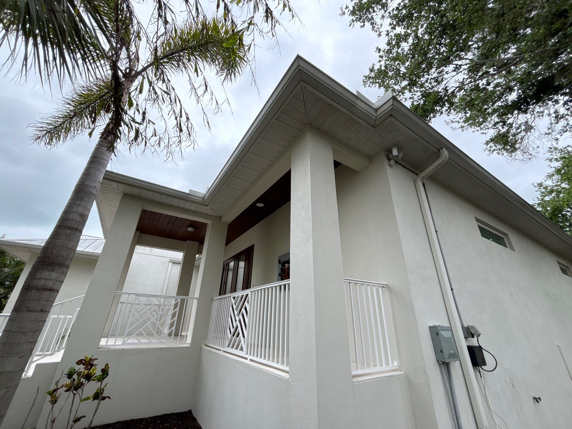 6-Inch White Seamless Gutters Installation in Siesta Key FL by Gutter Professors