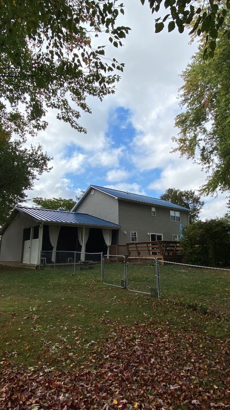 Residential Roofing Installation using Standing Seam Metal - Gallary Blue by RoofX 