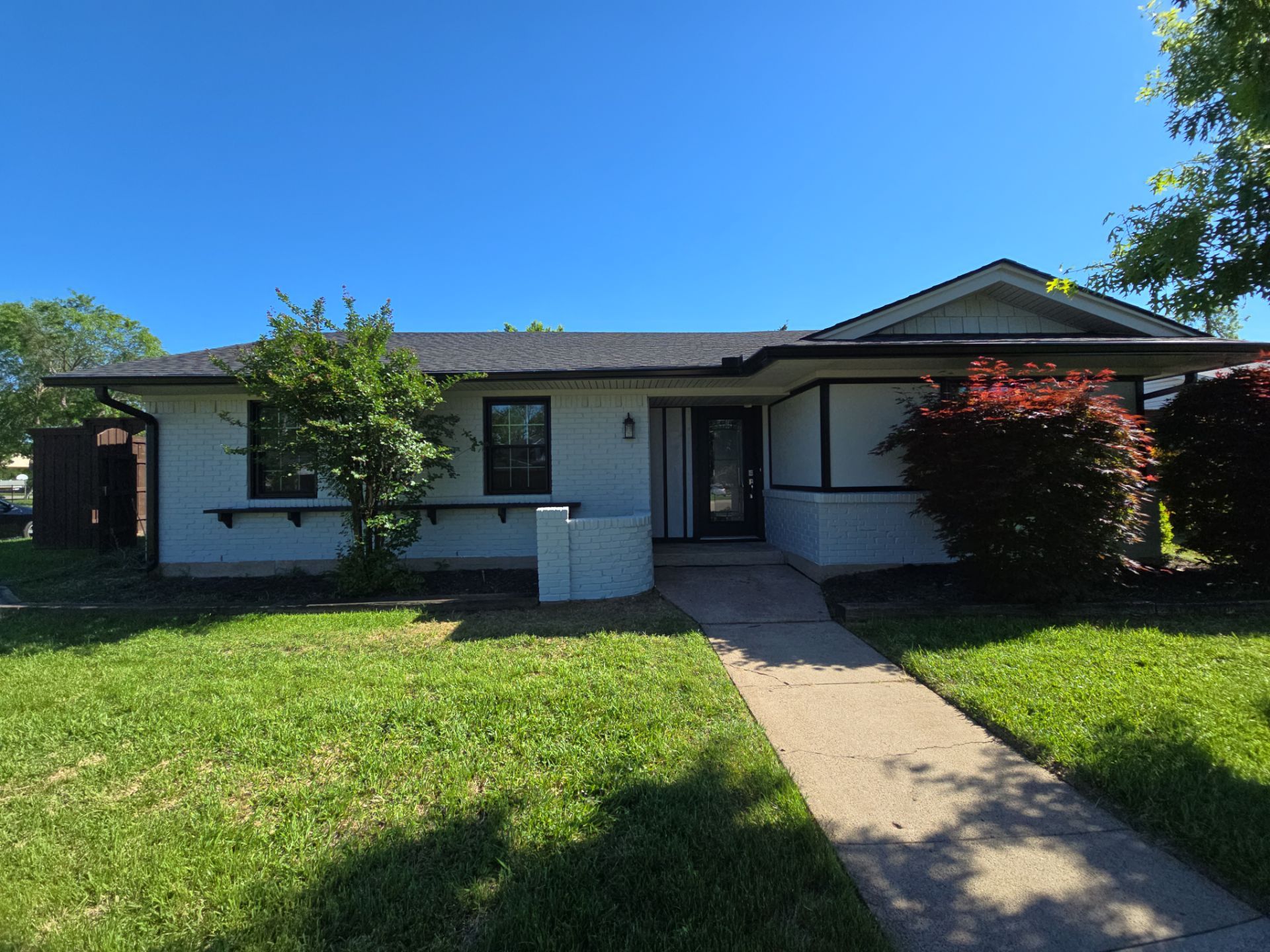 Exterior Home Paint Project with Different Surfaces by SLM General Contractors & Roofing