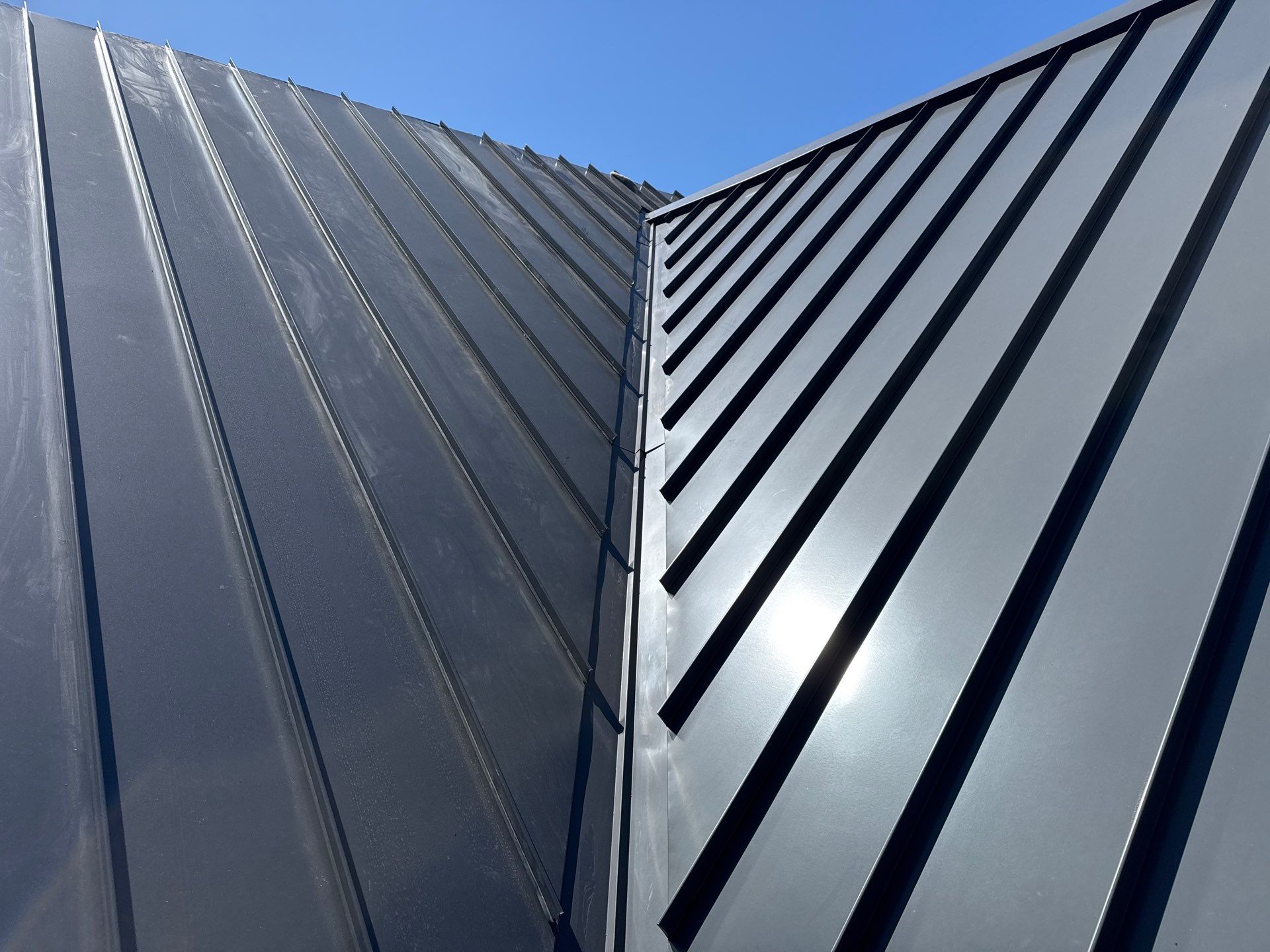 Custom New Construction Home Featuring Standing Seam Metal Roofing in Port Haywood by Cade Construction