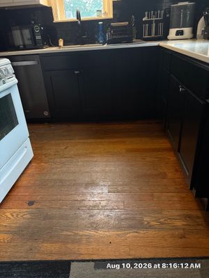 Modern Kitchen Renovation with Black and White Cabinetry in Lincoln