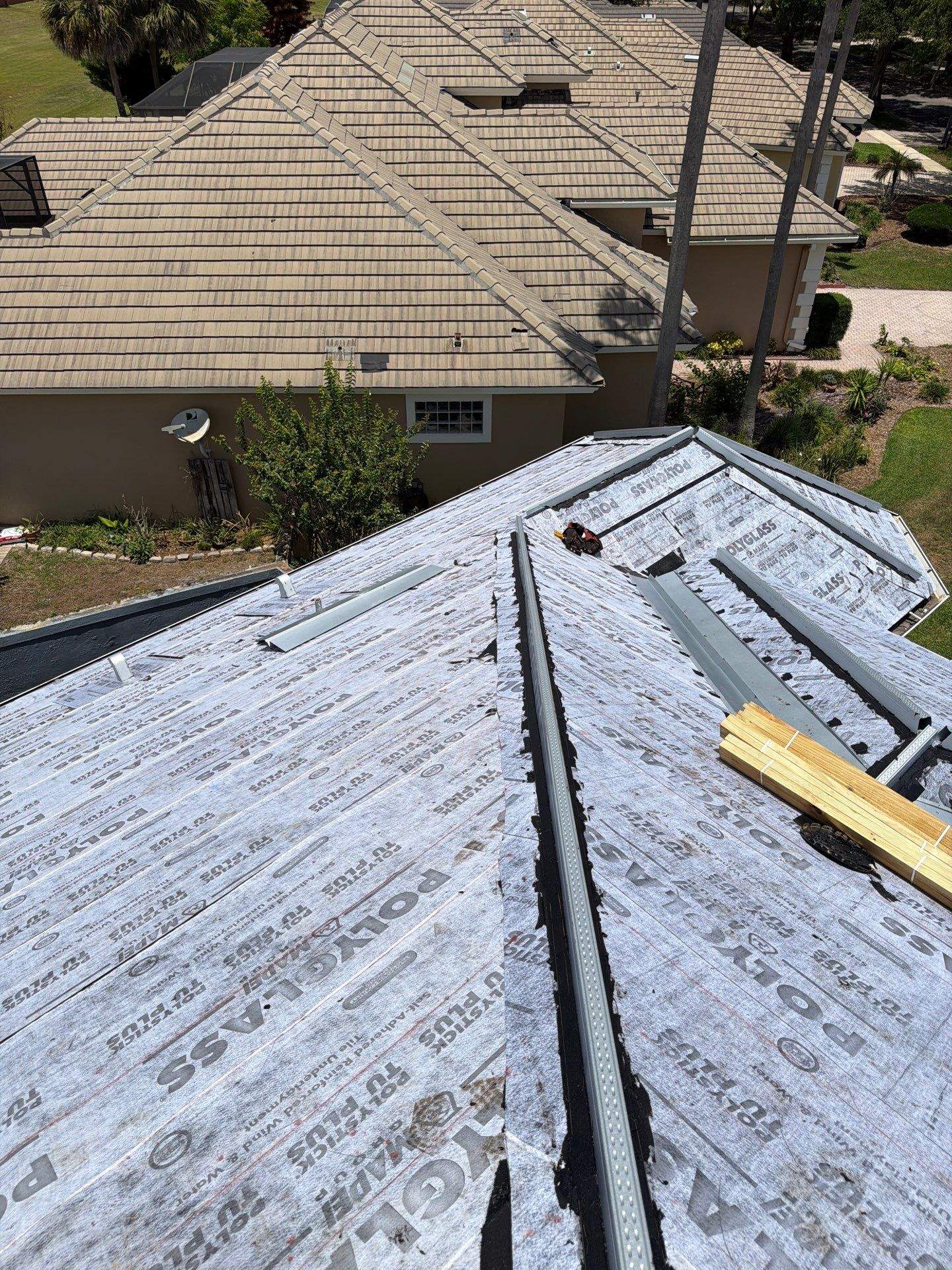 Winter Park Concrete Tile Roof Replacement and Chimney Flashing Installation by Fortified Roofing Solutions Corp.