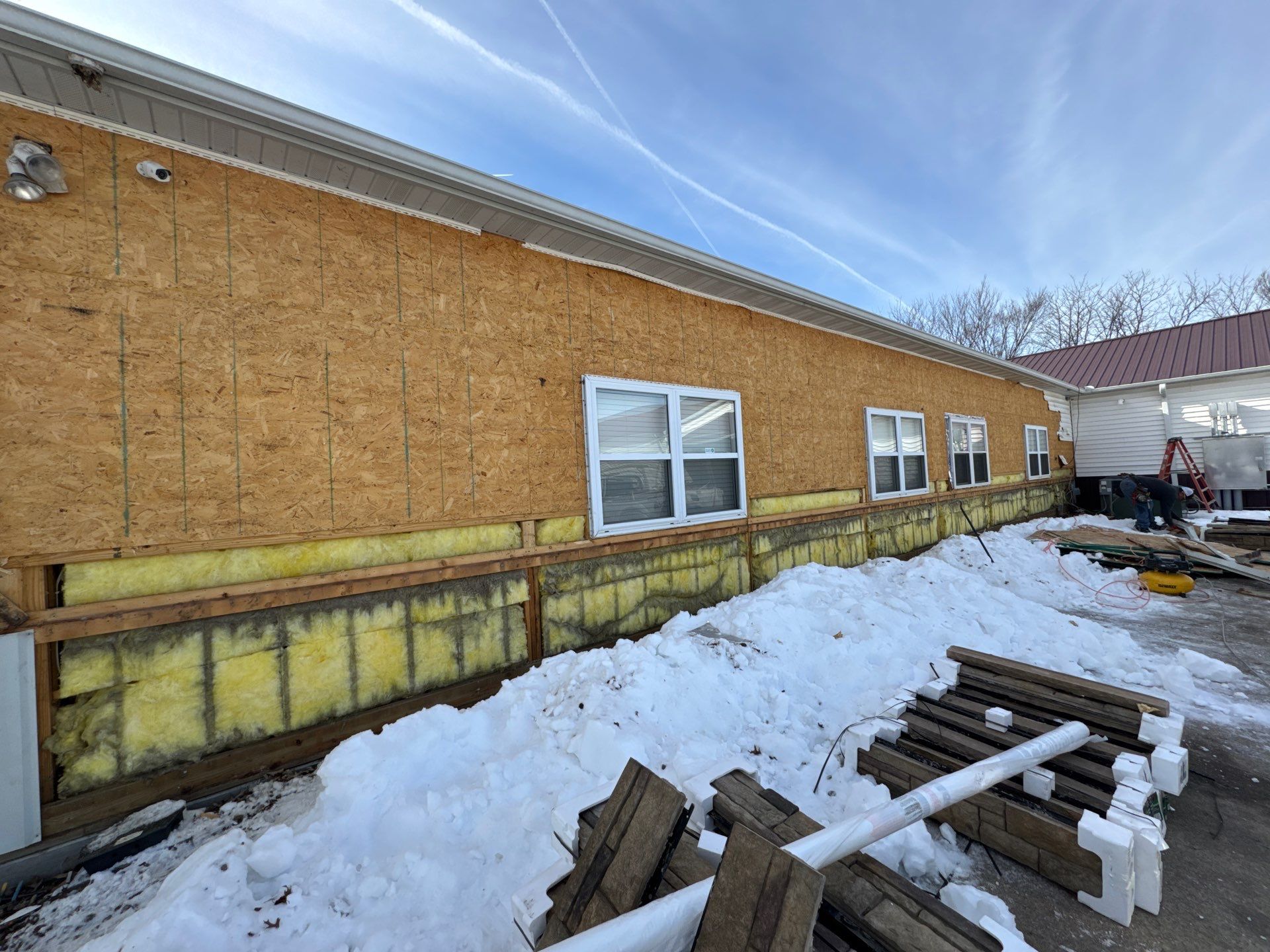 Siding and Stone Installation using Extrerior Porfolio Vinyl Siding and Versetta Stone by EEC  Windows, Siding & Roofing 
