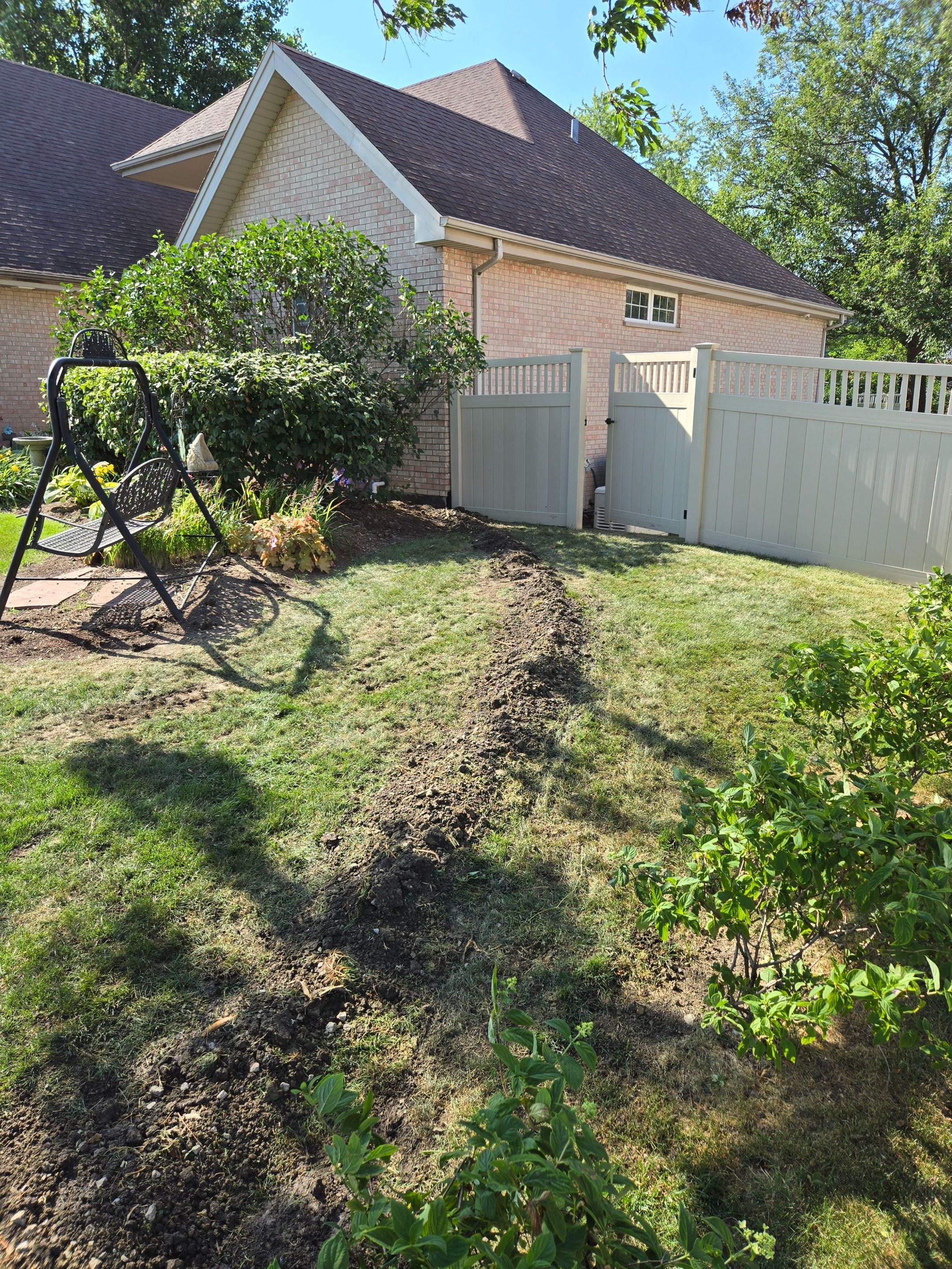 Burial of Sump Pump and Down Spout Discharges and Partial Waterproofing of Wall by Allied Water Services