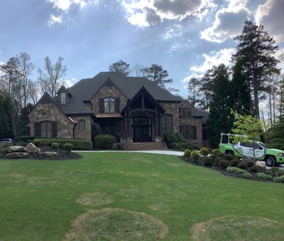 Exterior Painting and Trim Refresh for Large Brick Residence in Suwanee