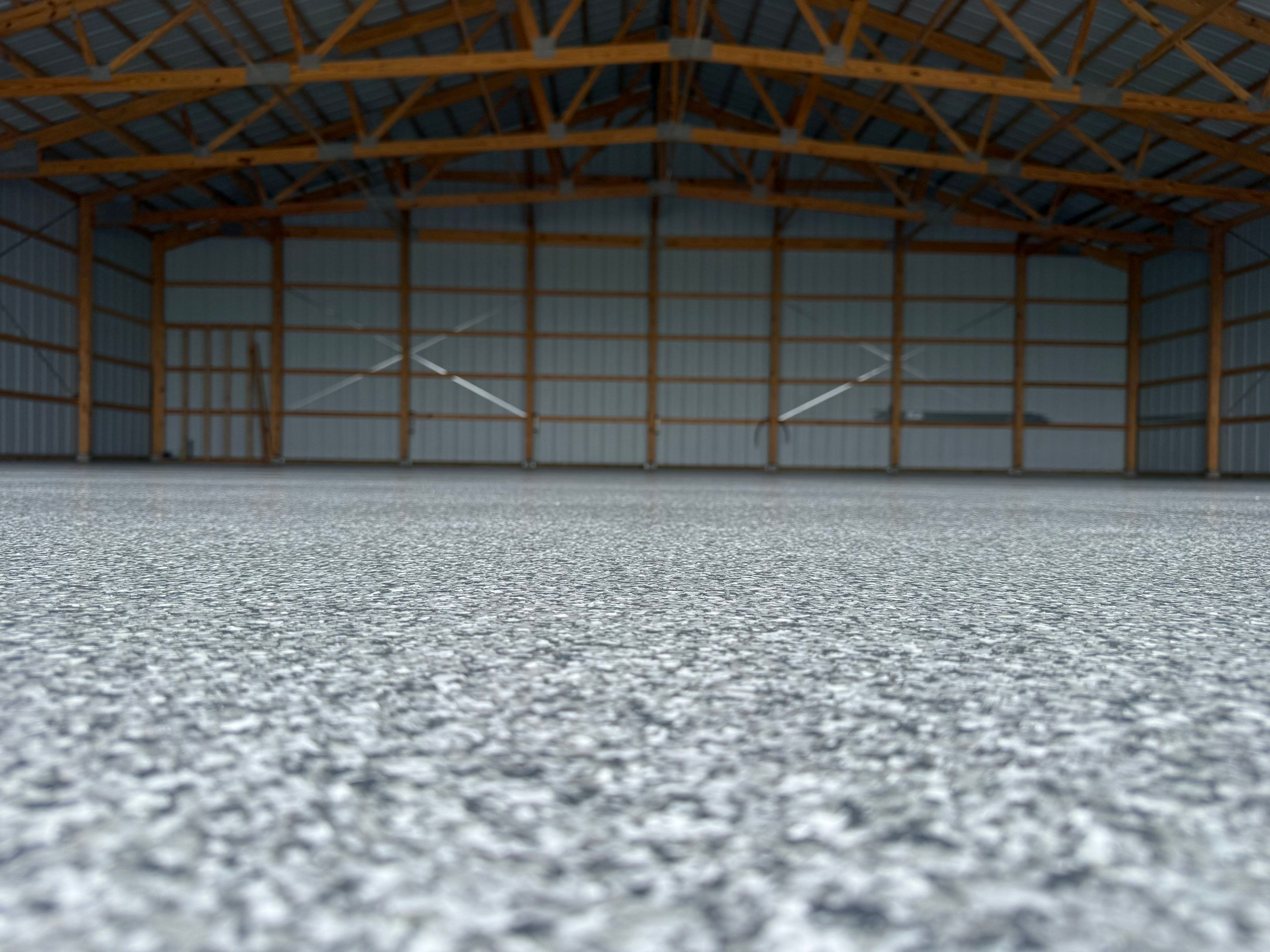 Durable Grey Speckled Epoxy Floor Coating for Yankton Shop by Select Painting, Coatings & Garage Cabinets