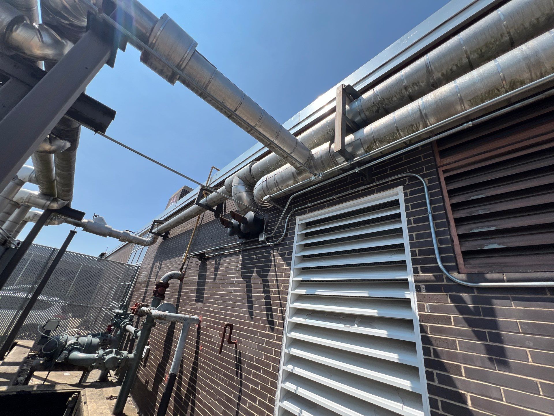 commercial pressure washing using Algaecide, soft wash soap by Northern Power Washing LLC.