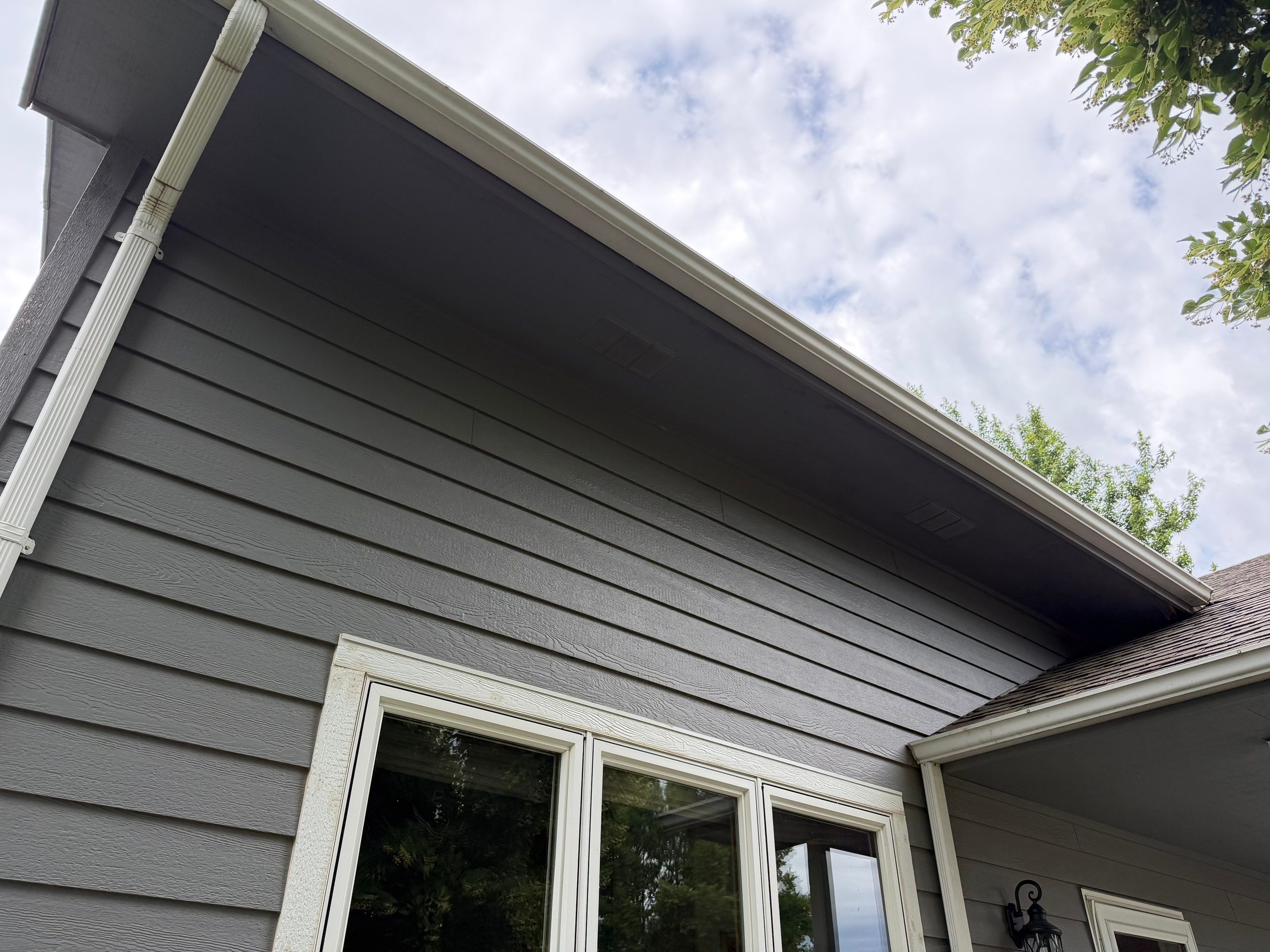 Full Exterior Painting for Gray Siding and Trim in Sioux Falls by Select Painting, Coatings & Garage Cabinets