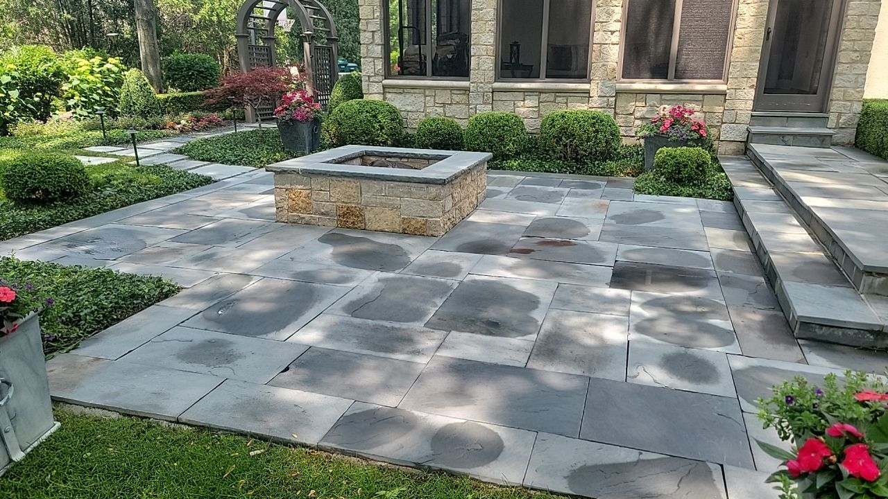Northbrook, IL stucco home soft wash and stone cleaning by Northern Power Washing LLC.