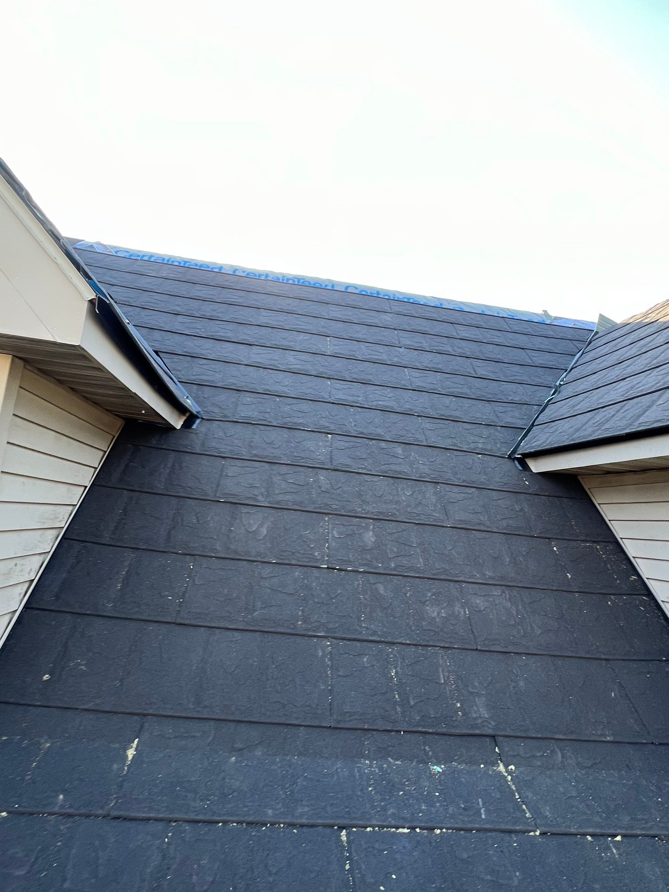 Residential Roofing Repair using Metstar Stone Coated Charcoal by Nitro Roofing and Construction