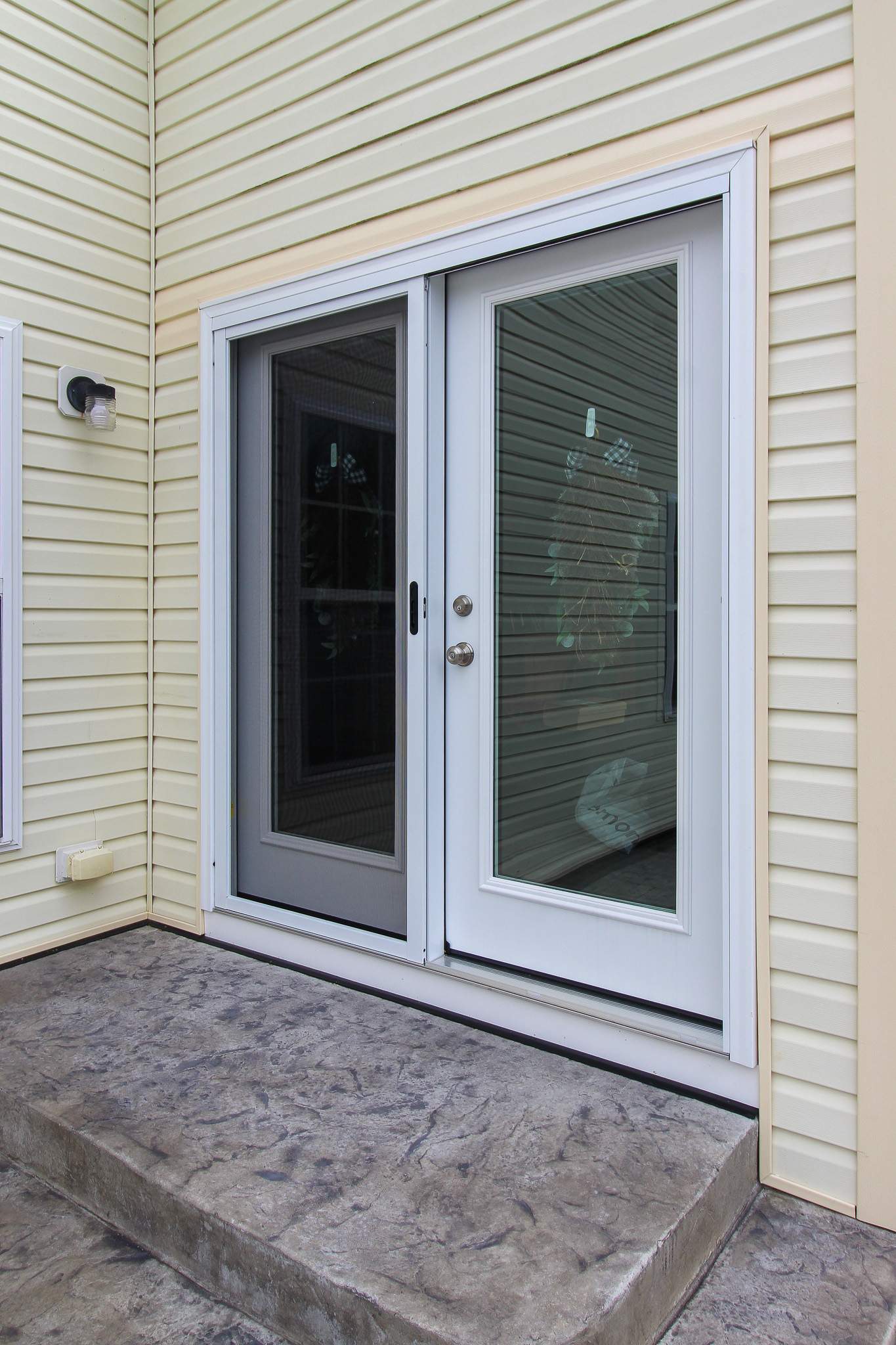 Stamped Concrete, Entry Door, and Concrete  by Ivy Lea Construction