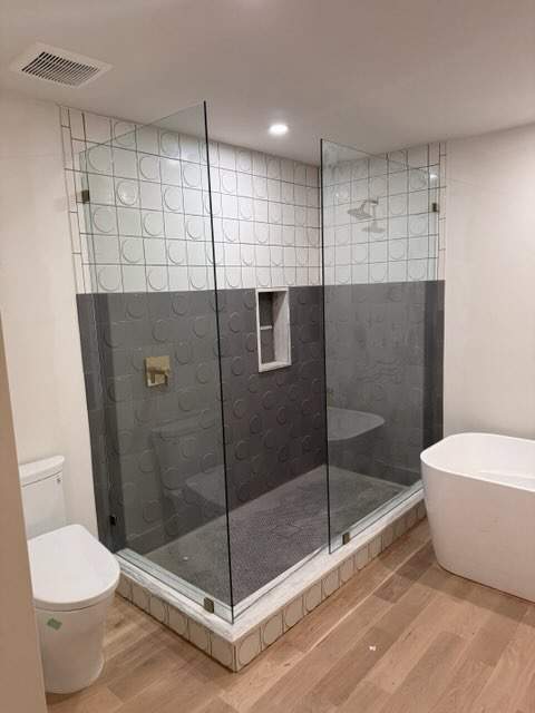 Multiple Frameless Shower Installs by Richardson Glass & Mirror