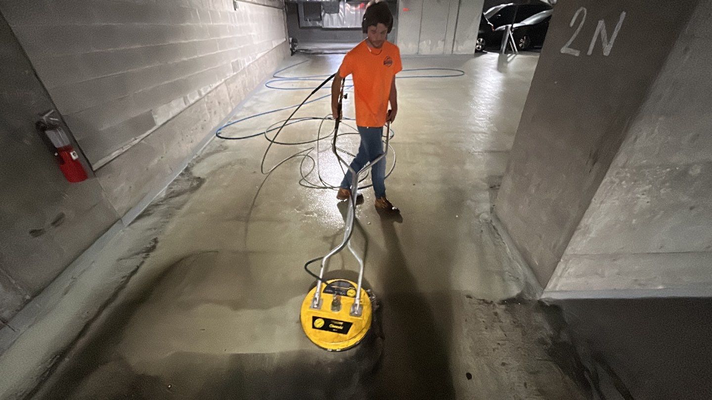 Parking garage using Hot water by Northern Power Washing LLC.