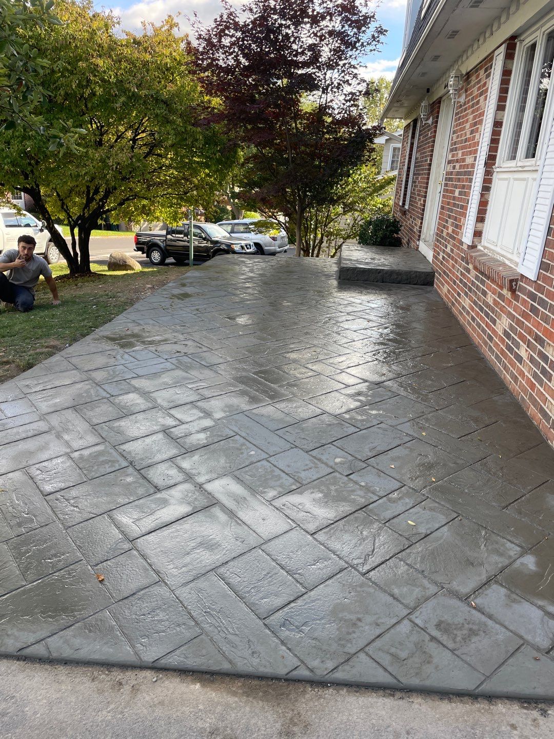Ashlar slate stamped concrete patio  by NG Masonry & Construction LLC