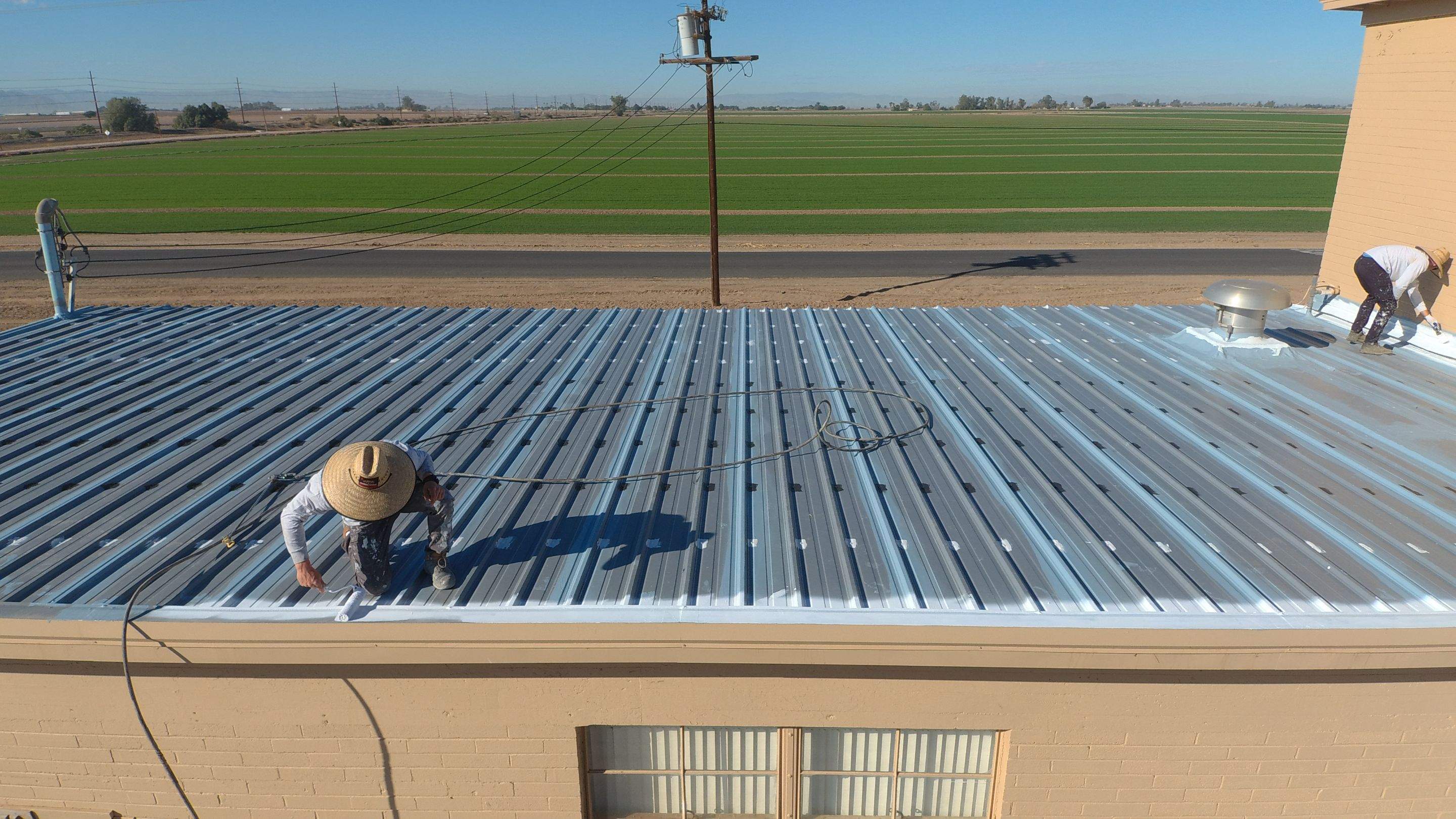 Metal roof restoration on commercial roof using Conklin Benchmark/PUMA XL fabric and coating by Straight Edge Roofing Inc