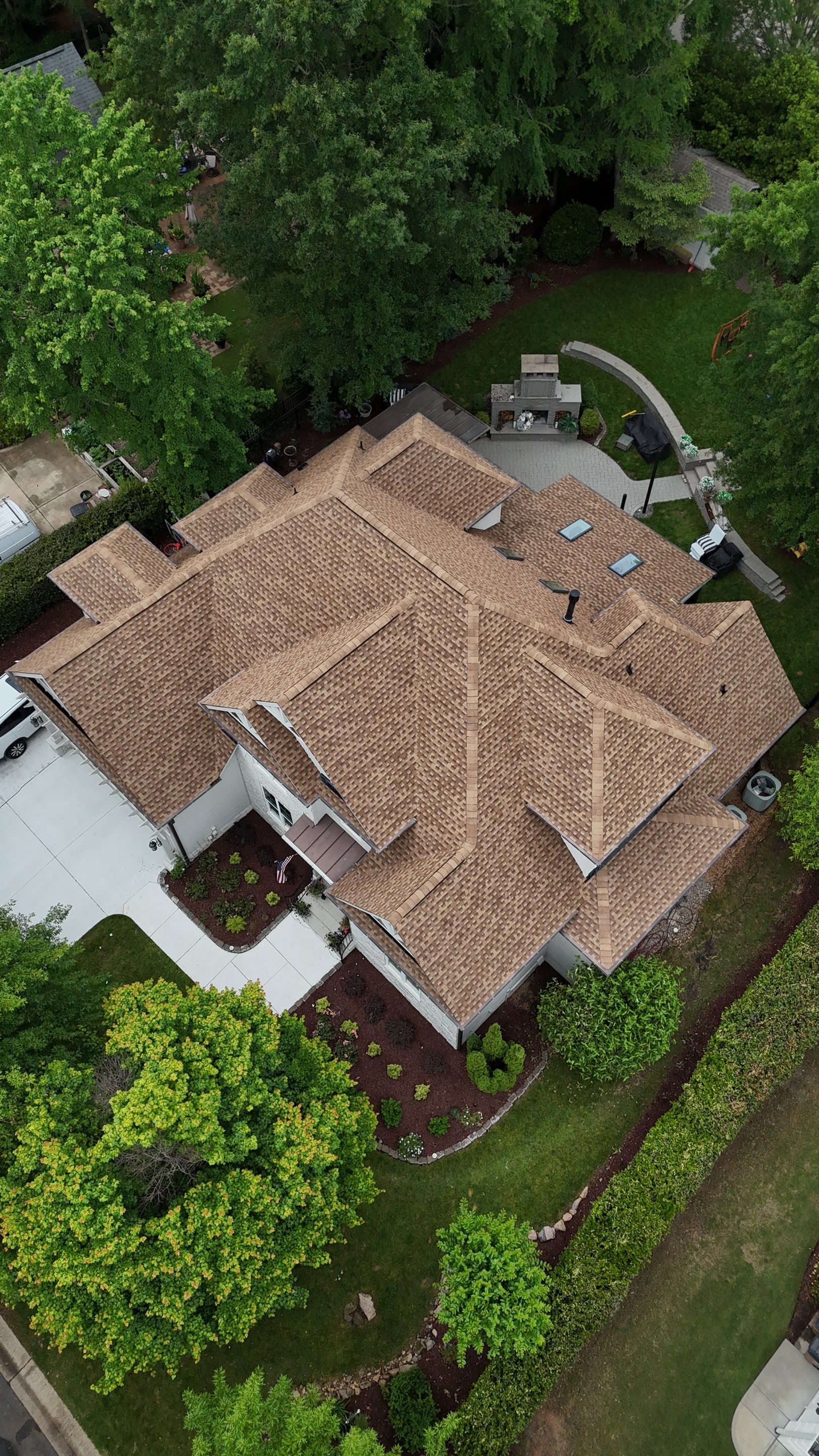 Roof Replacement - GAF Timberline HDZ Shakewood - 6” coppertone seamless gutters by Pro Performance Roofing