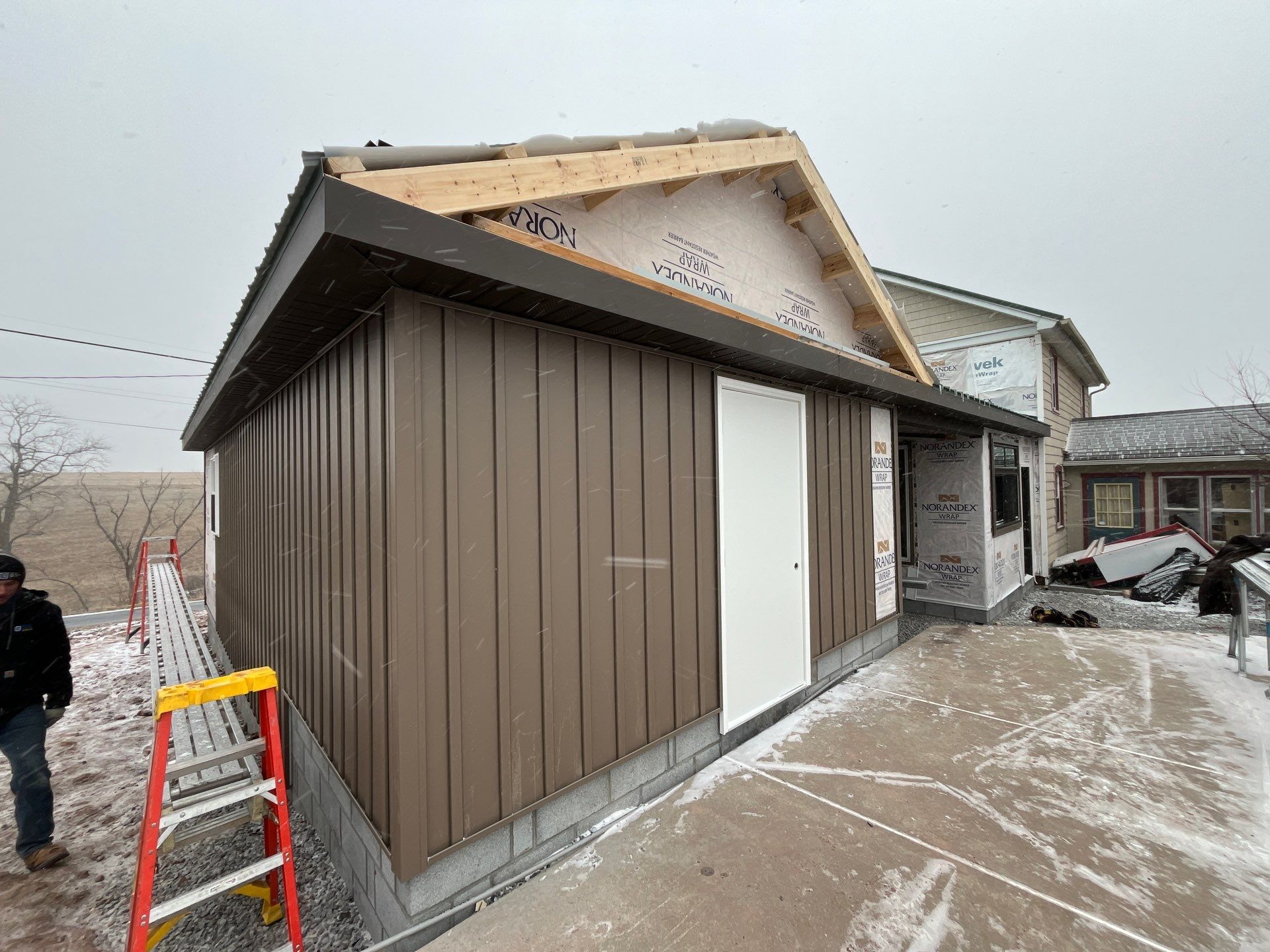 Multi-Story Residential Addition Featuring Textured Metal Siding in Millersburg by Esh Builders
