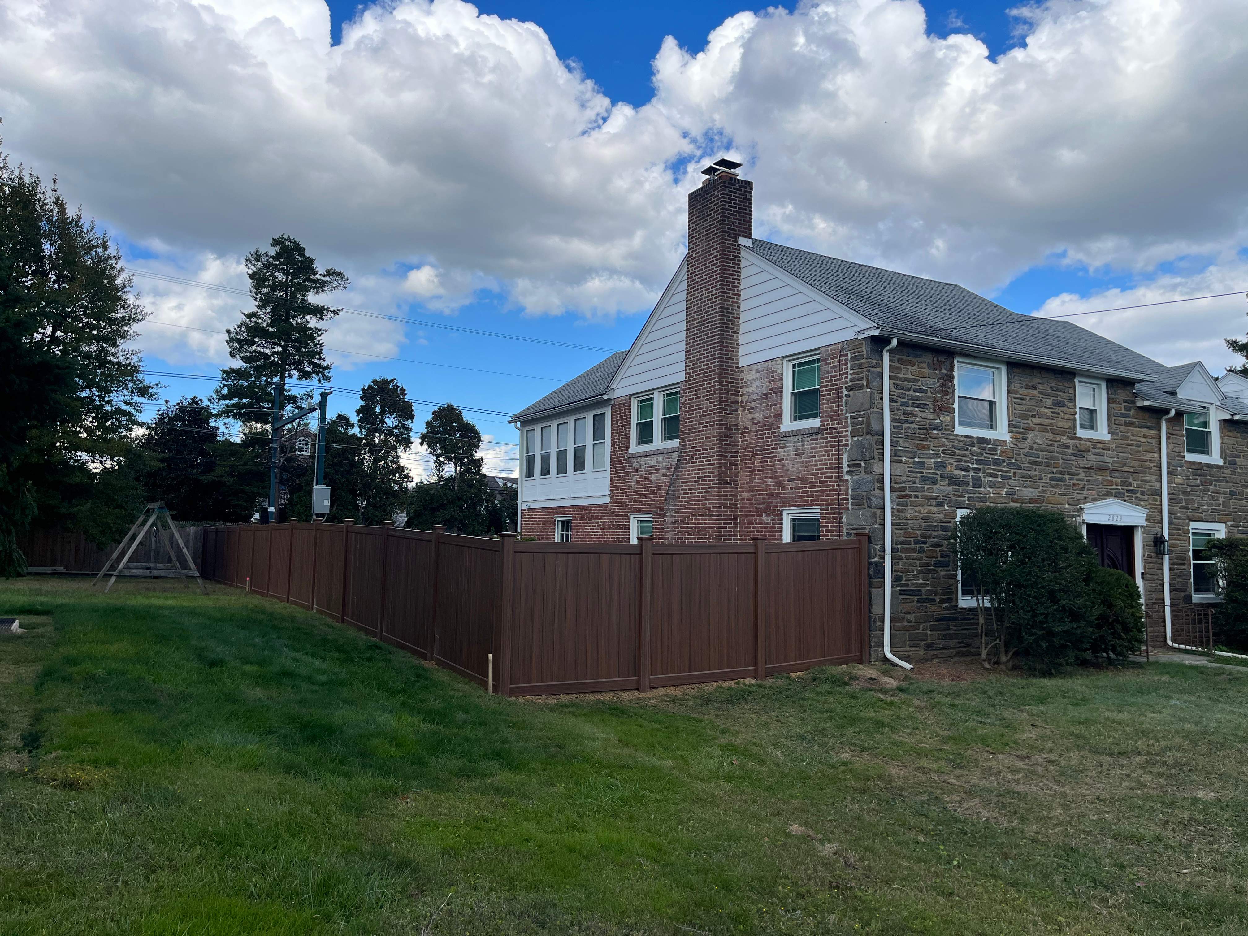6' High Mocha Walnut Vinyl Installation by Jensen Fencing