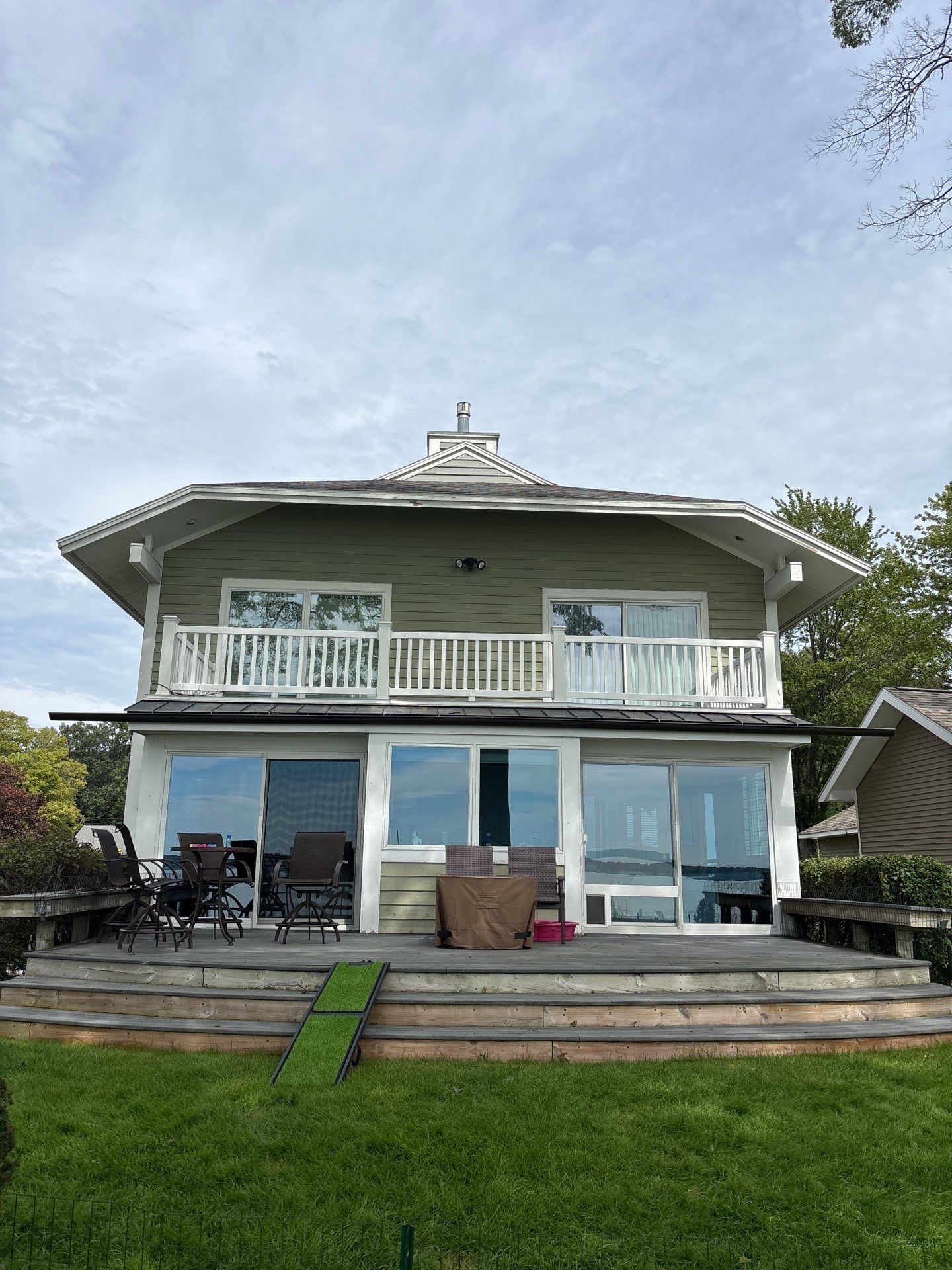 Full Exterior Painting and Trim Restoration for Muskegon Residence by Gordon Painting