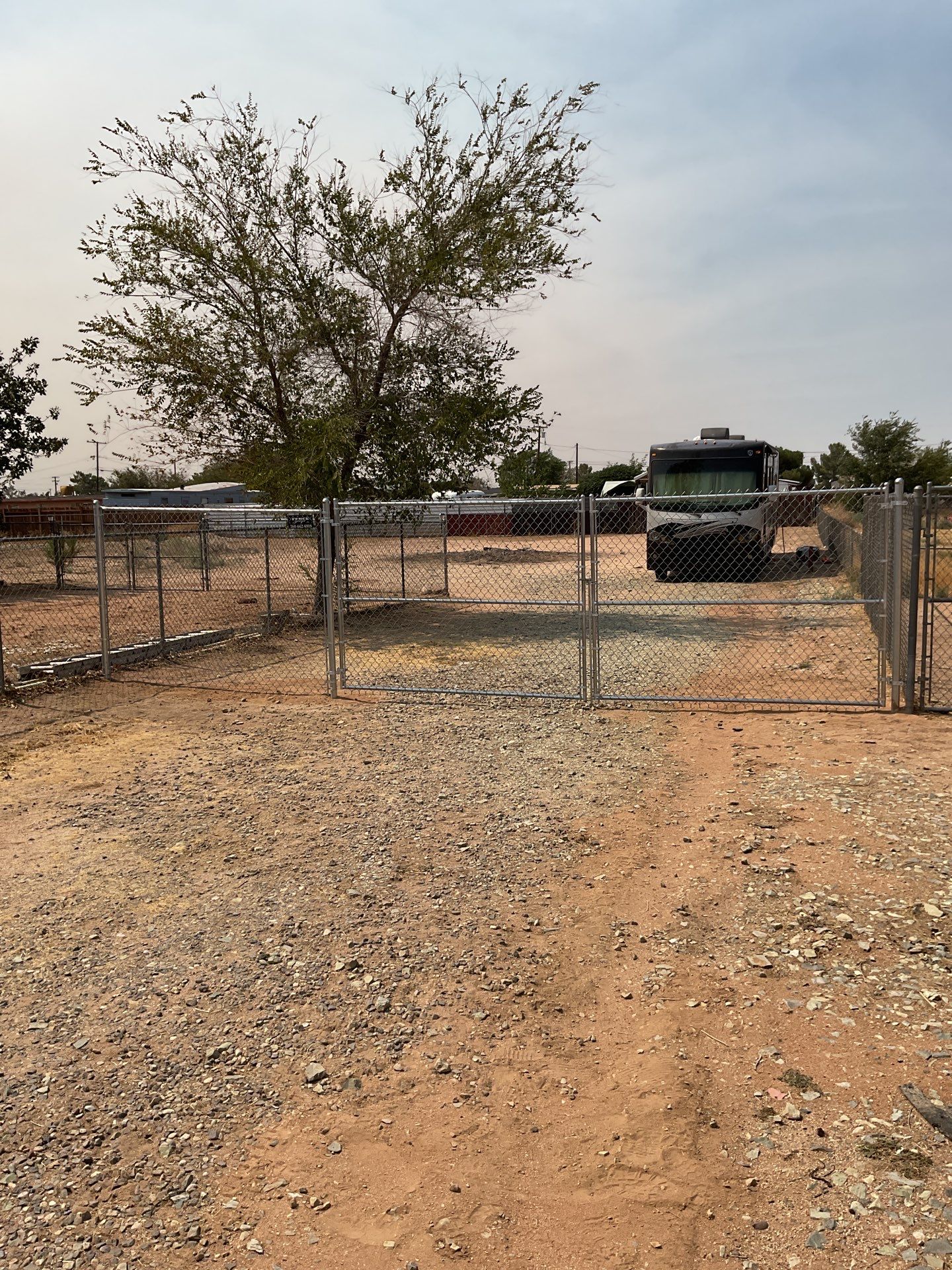 Gate installation using chain -link by Fence Guys Inc.