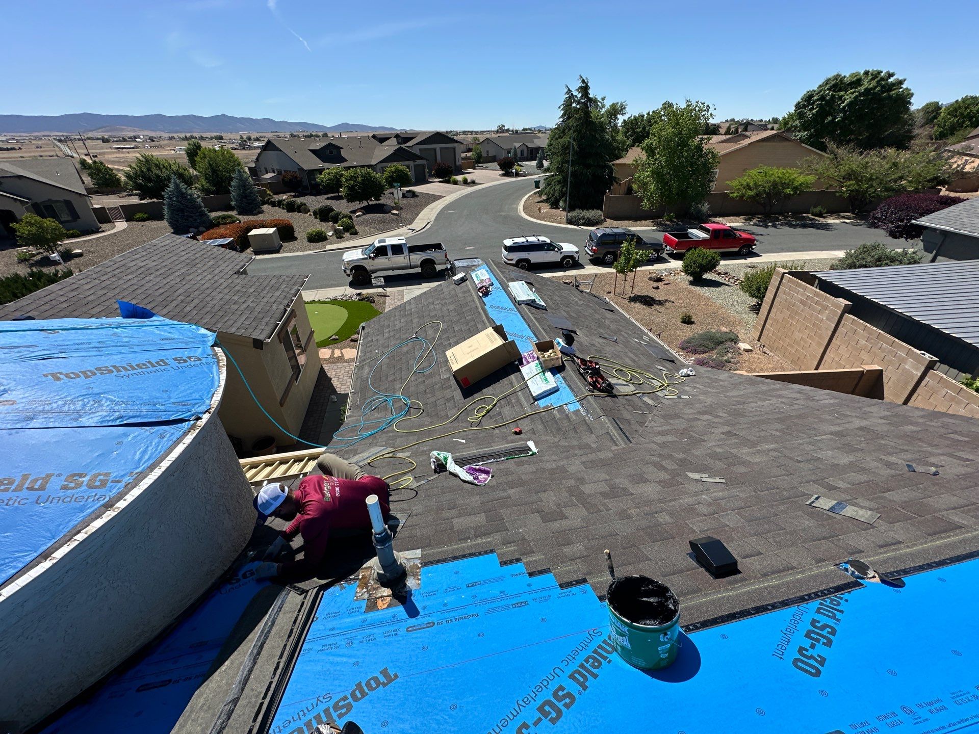 Residential Roofing Installation with Architectural Shingles and Turret Detail by Badger Roofing