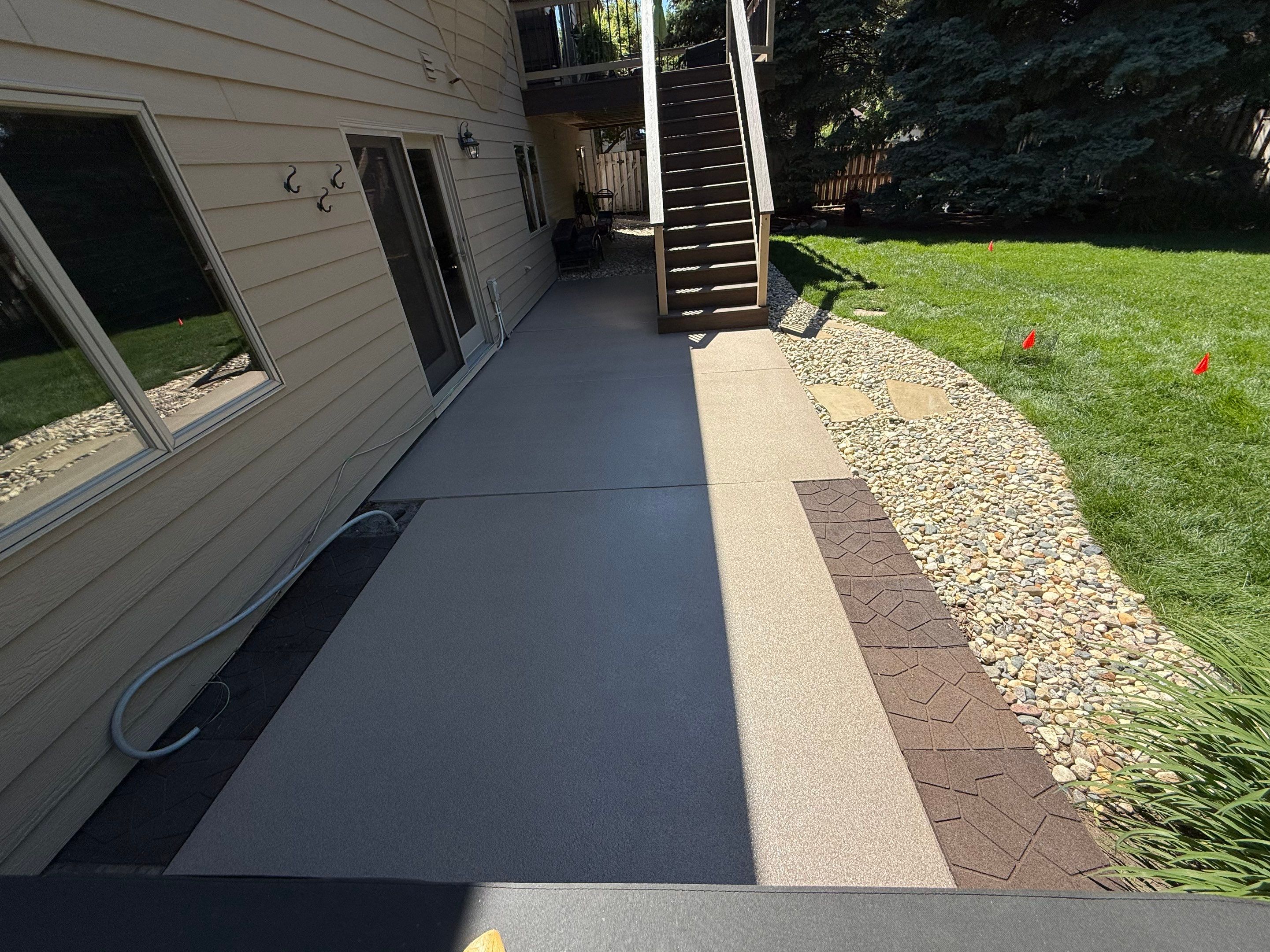Textured Concrete Coating and Paver Patio Refresh in Sioux Falls by Select Painting, Coatings & Garage Cabinets