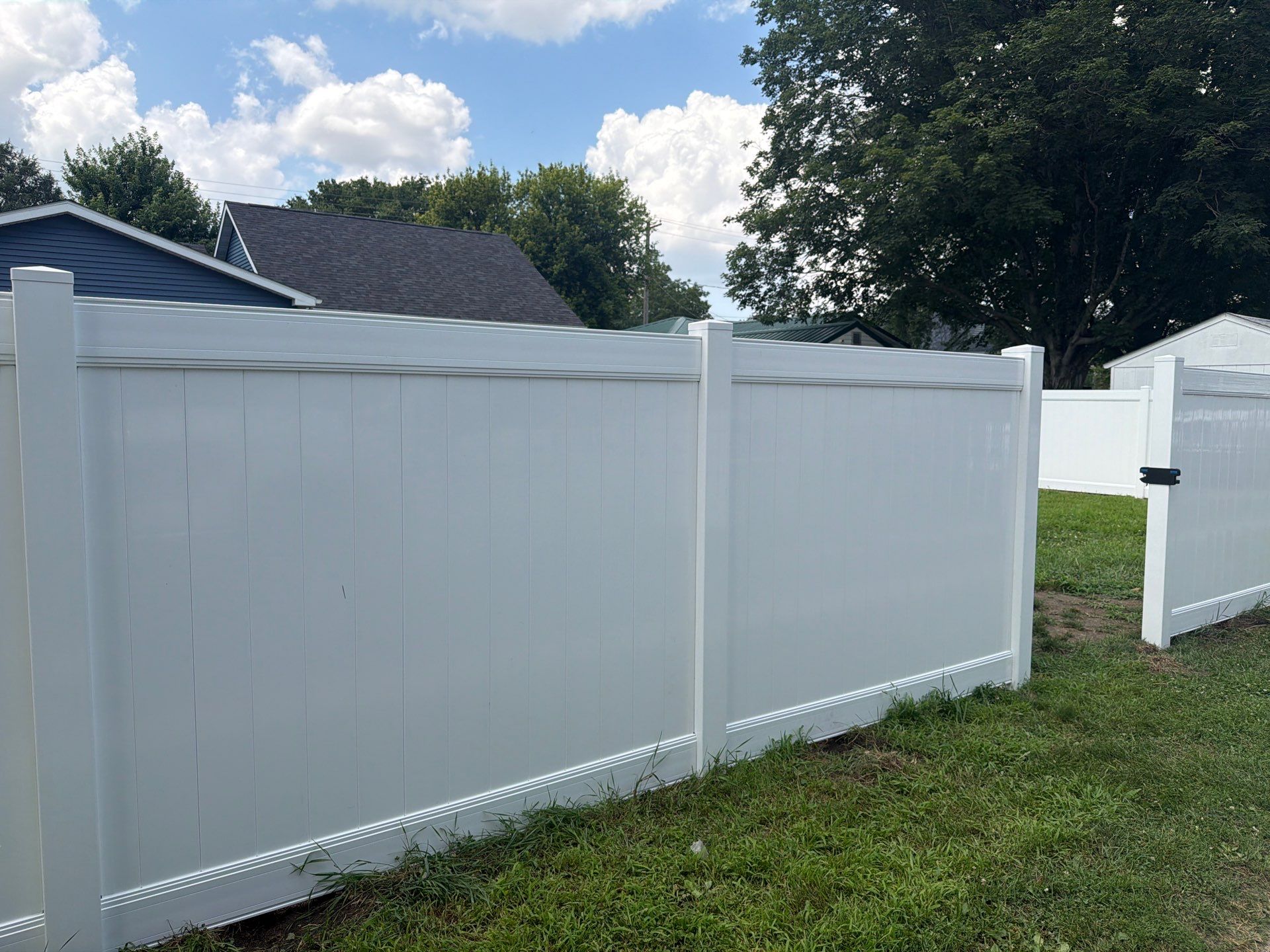 White Vinyl Privacy Fence Installation in Waterloo, Iowa by Perfect Picket Fence and Stain