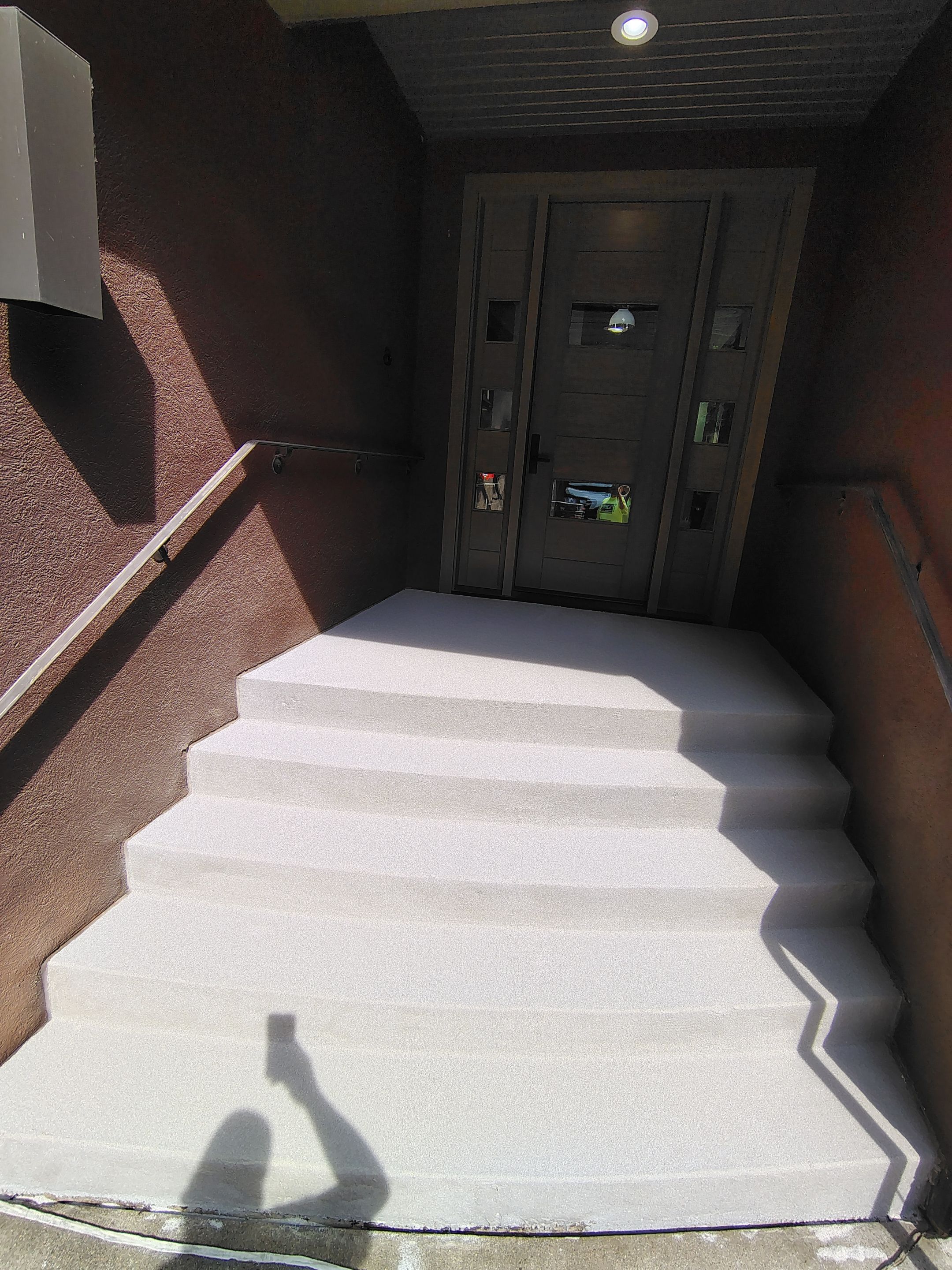 Garage Floor and Entry Step Concrete Coating in Sioux Falls by Select Painting, Coatings & Garage Cabinets