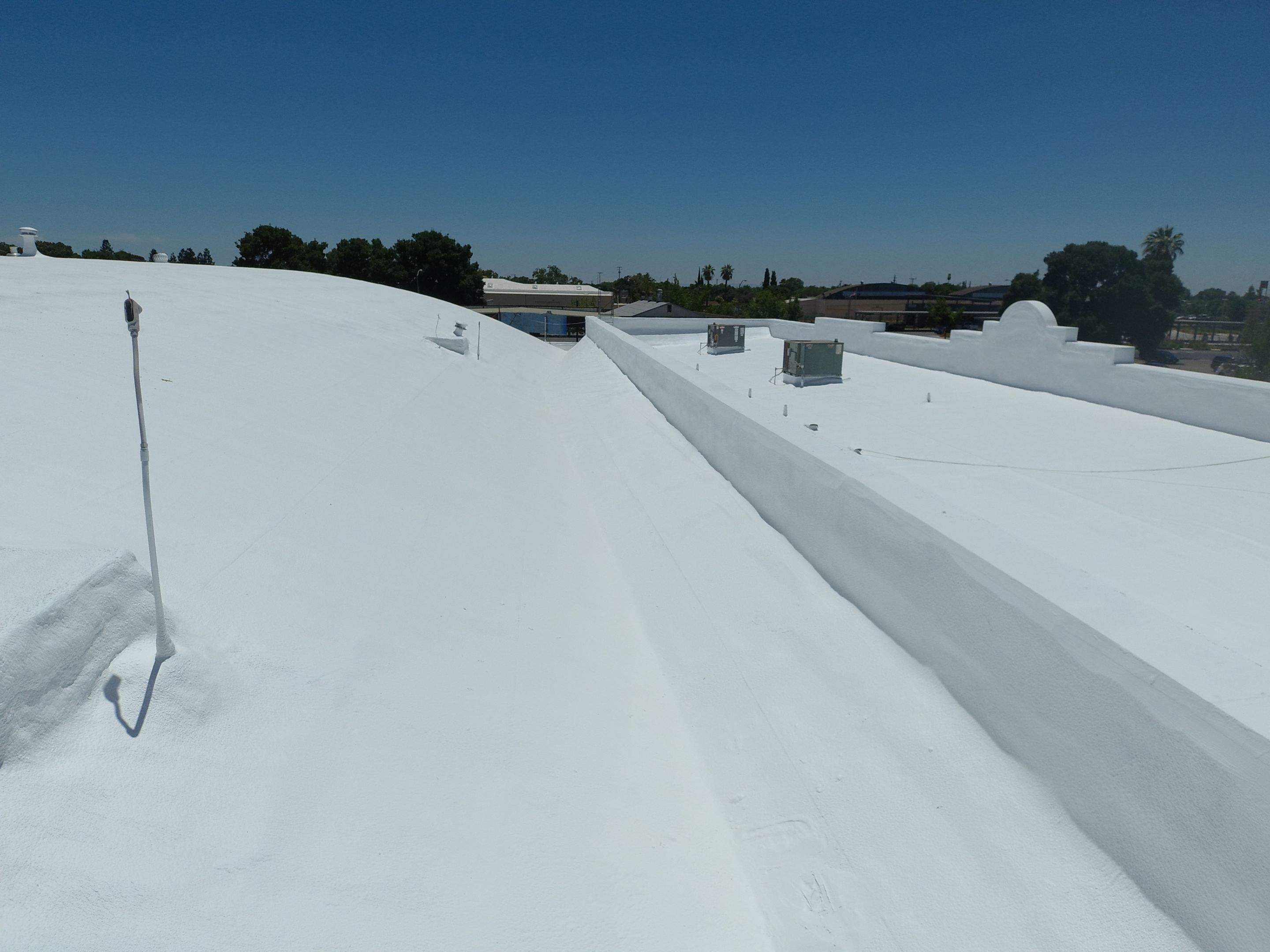 Spray foam and coatings using Conklin Benchmark/PUMA XL coatings and spray foam by Straight Edge Roofing Inc