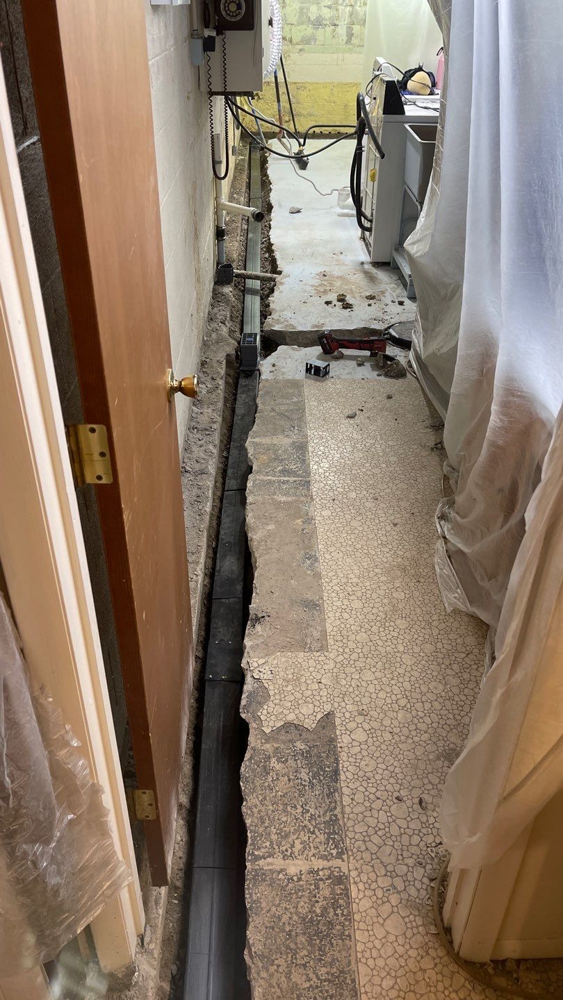 Interior Waterproofing Using GrateDrain™ Products by Toledo Basement Repair
