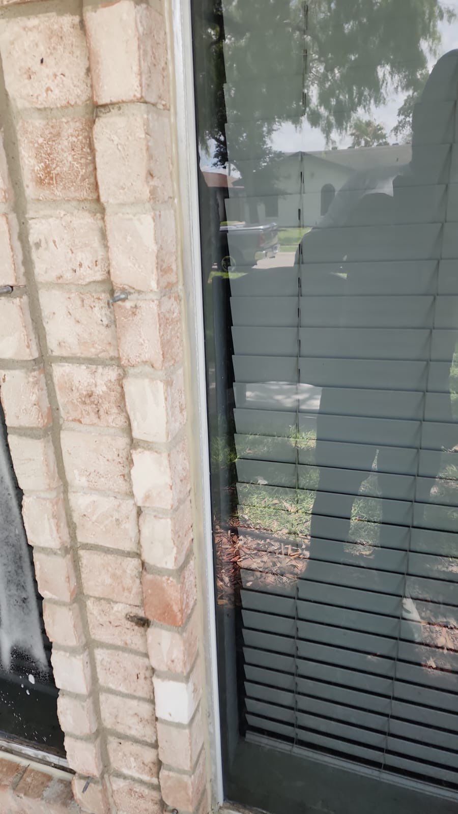 Colored Vinyl Windows to blend into brick by Bayfront Roofing and Construction