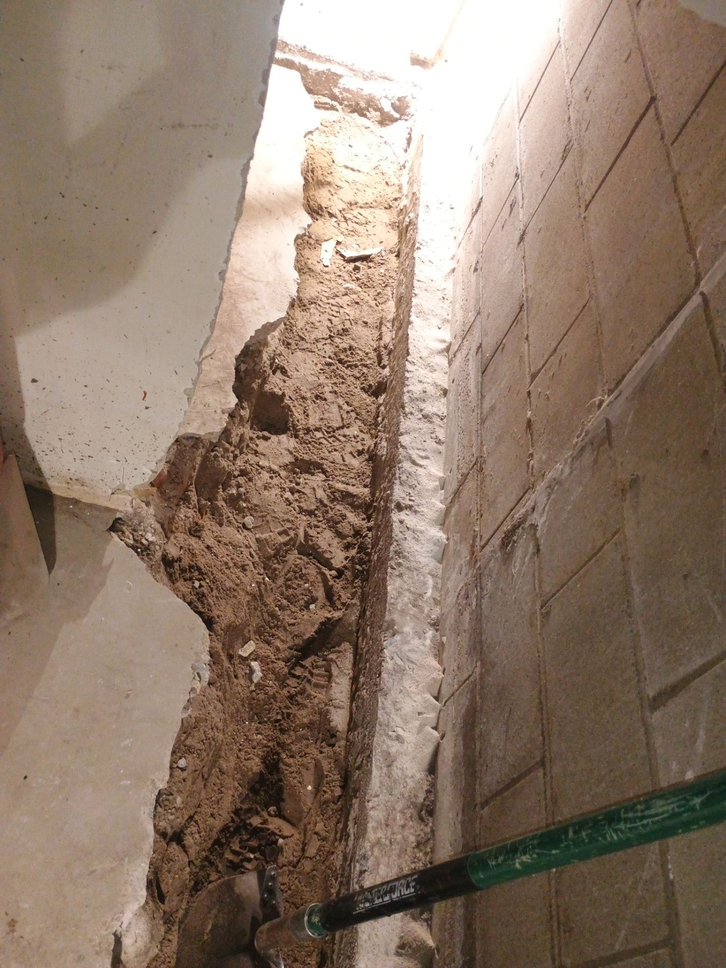 Interior Drain Tile & Buried Discharge in South Minneapolis by Waterproofing Northeast
