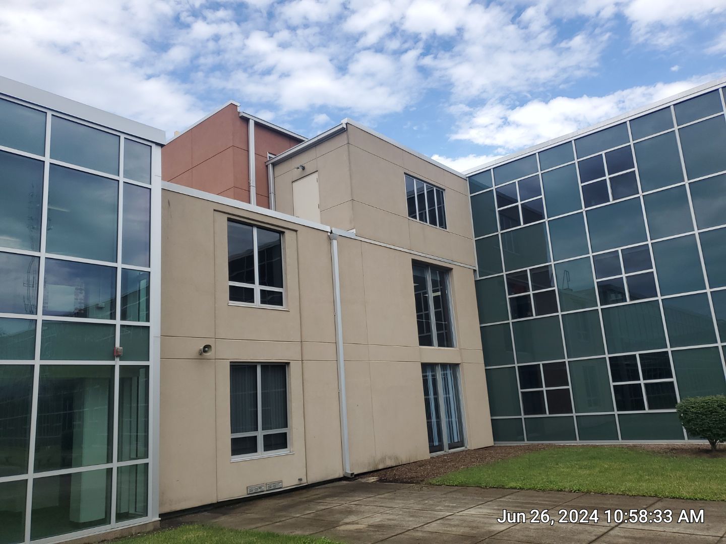concrete using Algaecide, soft wash soap by Northern Power Washing LLC.