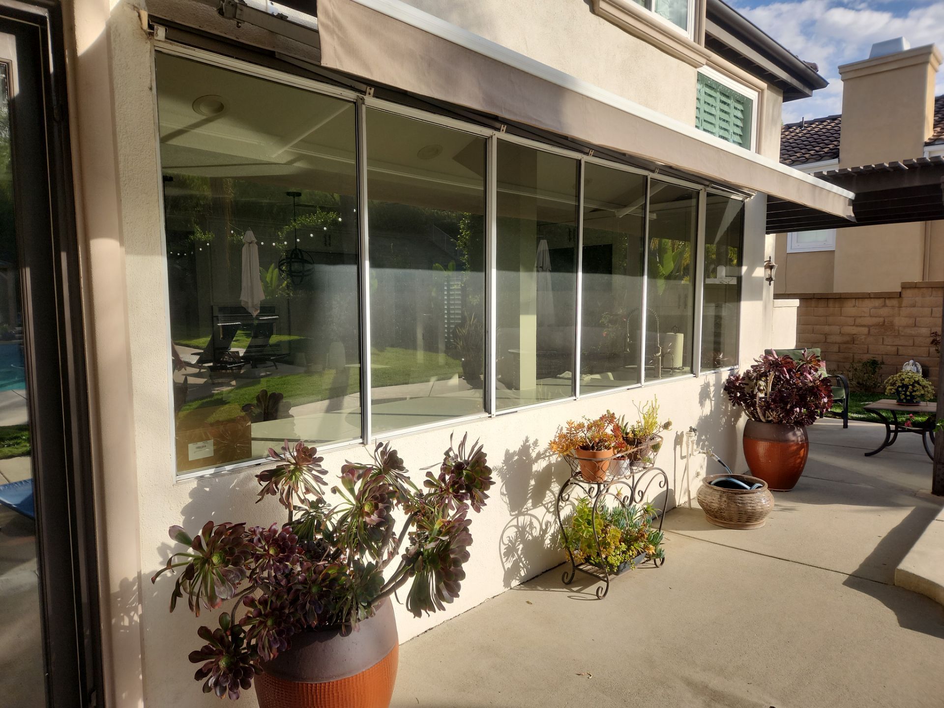 Window Installation using Anlin vinyl windows with Sunshield glass by American Window Company