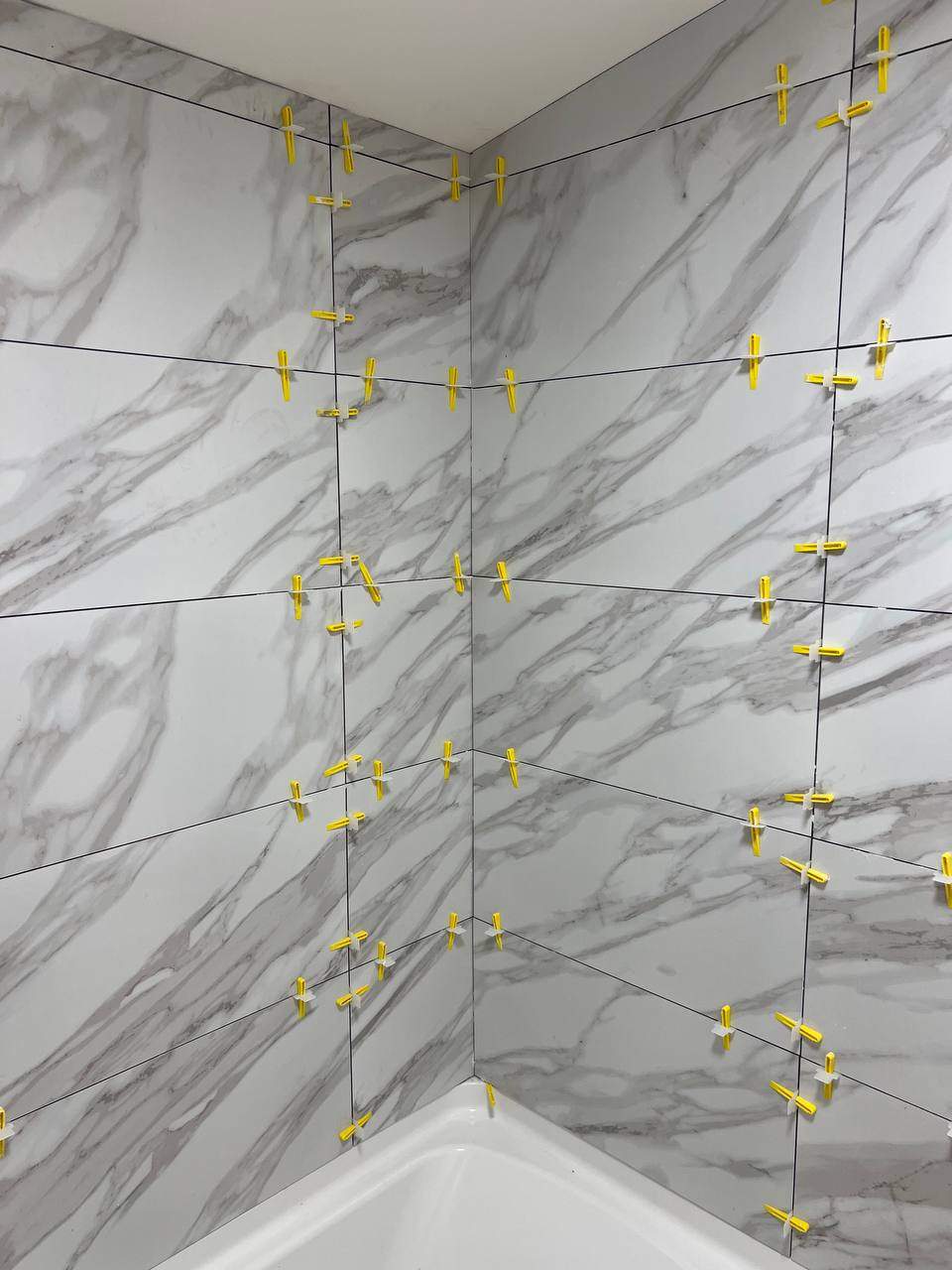 Shower wall tile by Handyman State LLC