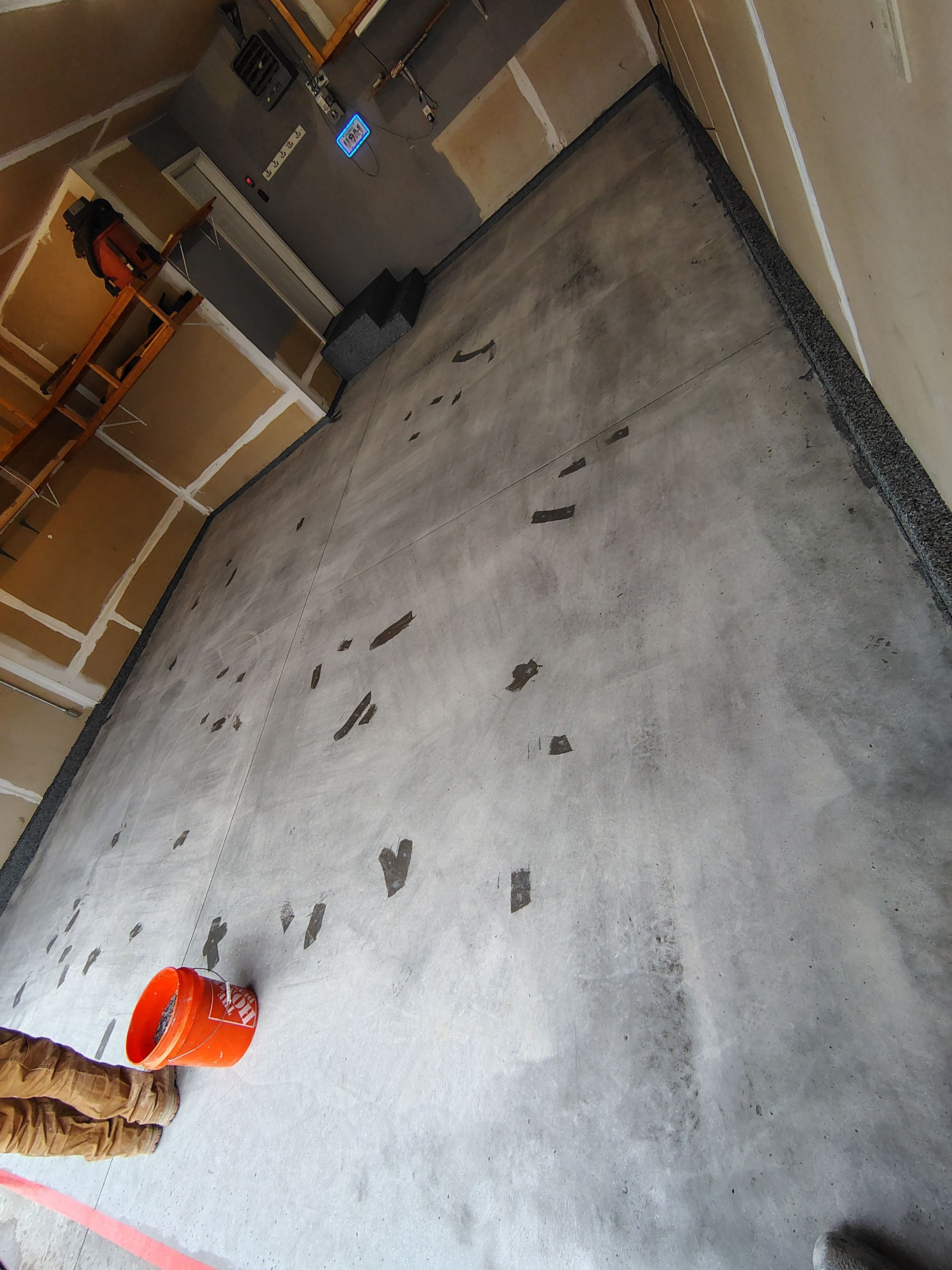 Nightfall Grey Speckled Epoxy Garage Floor Coating in Sioux Falls by Select Painting, Coatings & Garage Cabinets