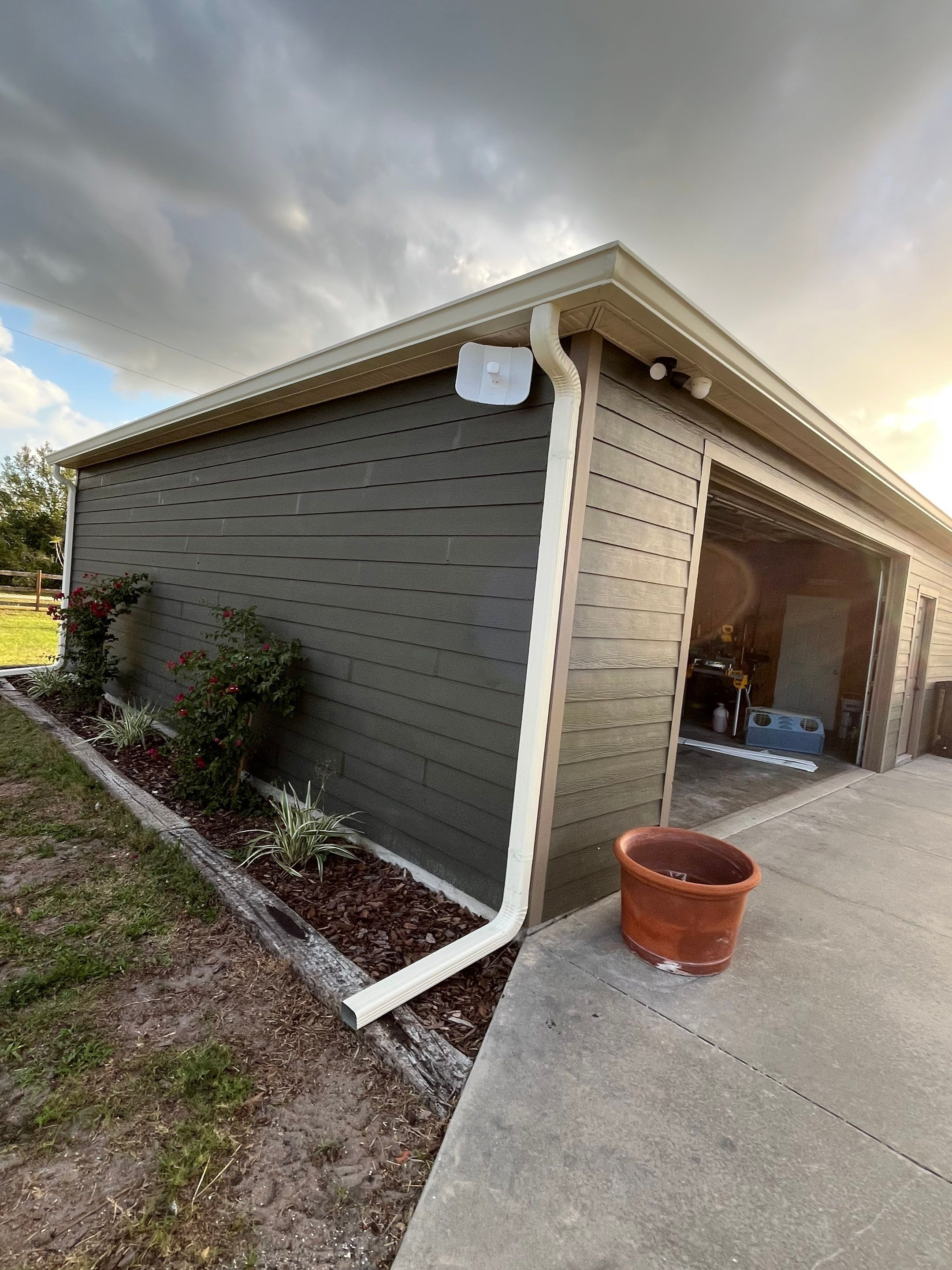  7-inch White seamless gutters and downspouts in Myakka City FL by Gutter Professors
