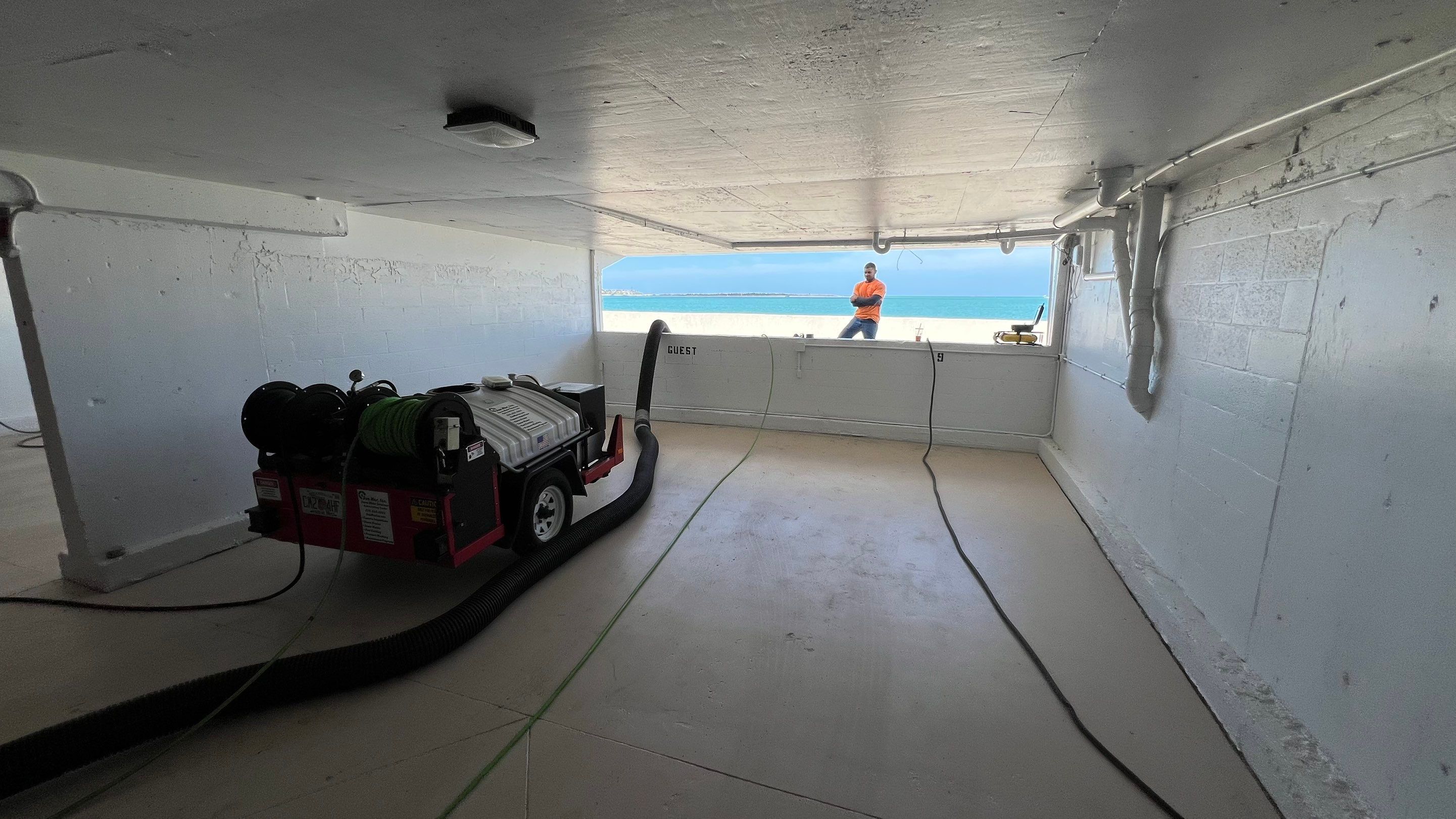 Isles of Capri Condo Parking Garage Drainage System Cleaning by APS Power & Water