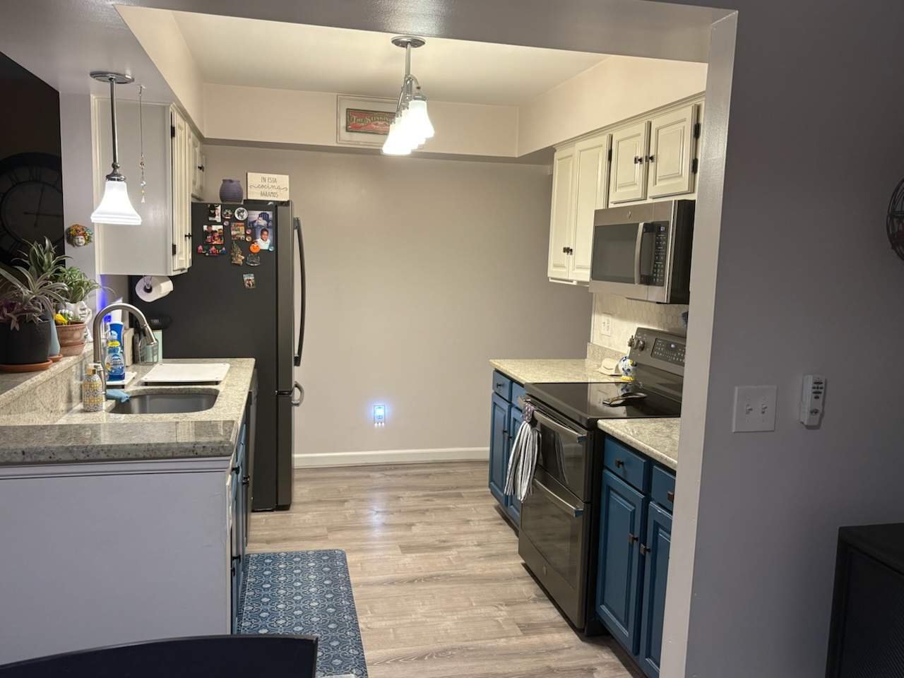 Two-Tone Kitchen Cabinet Refinishing and Granite Countertop Installation by Top Shelf Painter