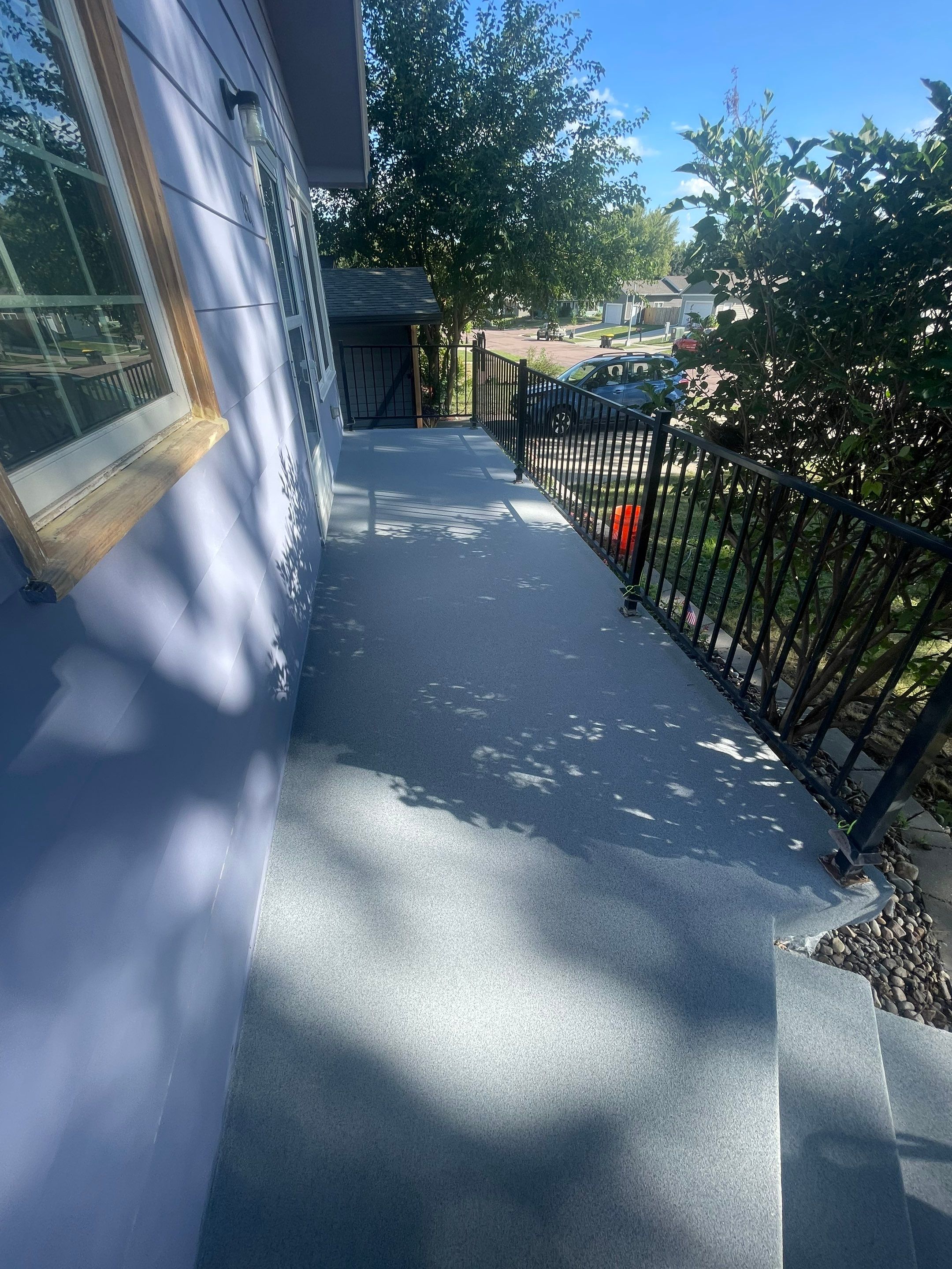 Sioux Falls Concrete Porch Coating with Starry Evening Finish by Select Painting, Coatings & Garage Cabinets