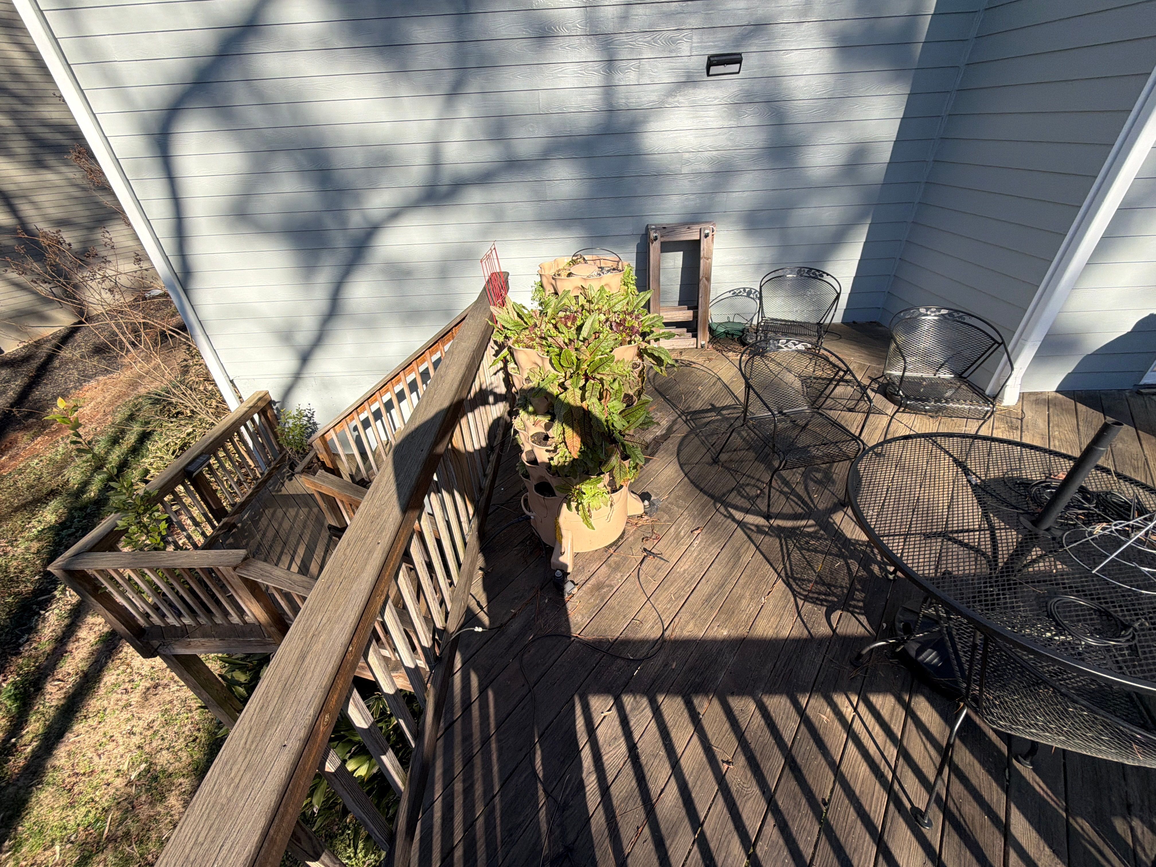 Covered Porch and Deck Build using Deckorators Venture Series Decking and Trex Select Aluminum Railing by Nelson Exteriors