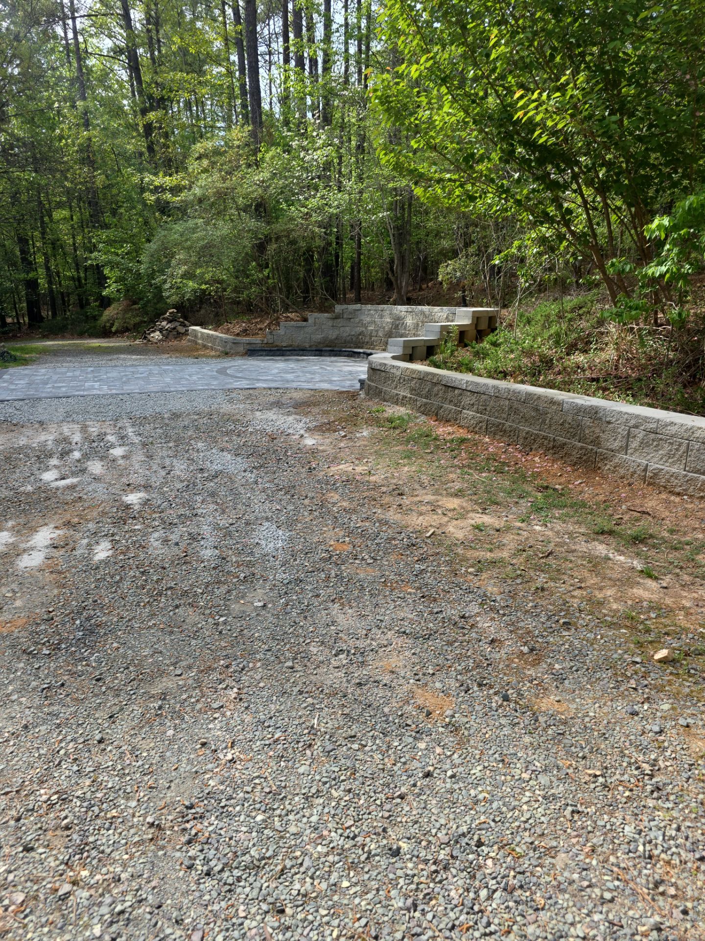 Pittsboro Outdoor Living Transformation – Retaining Wall, Paver Patio & Elevated Deck by Elite Remodeling and Design LLC