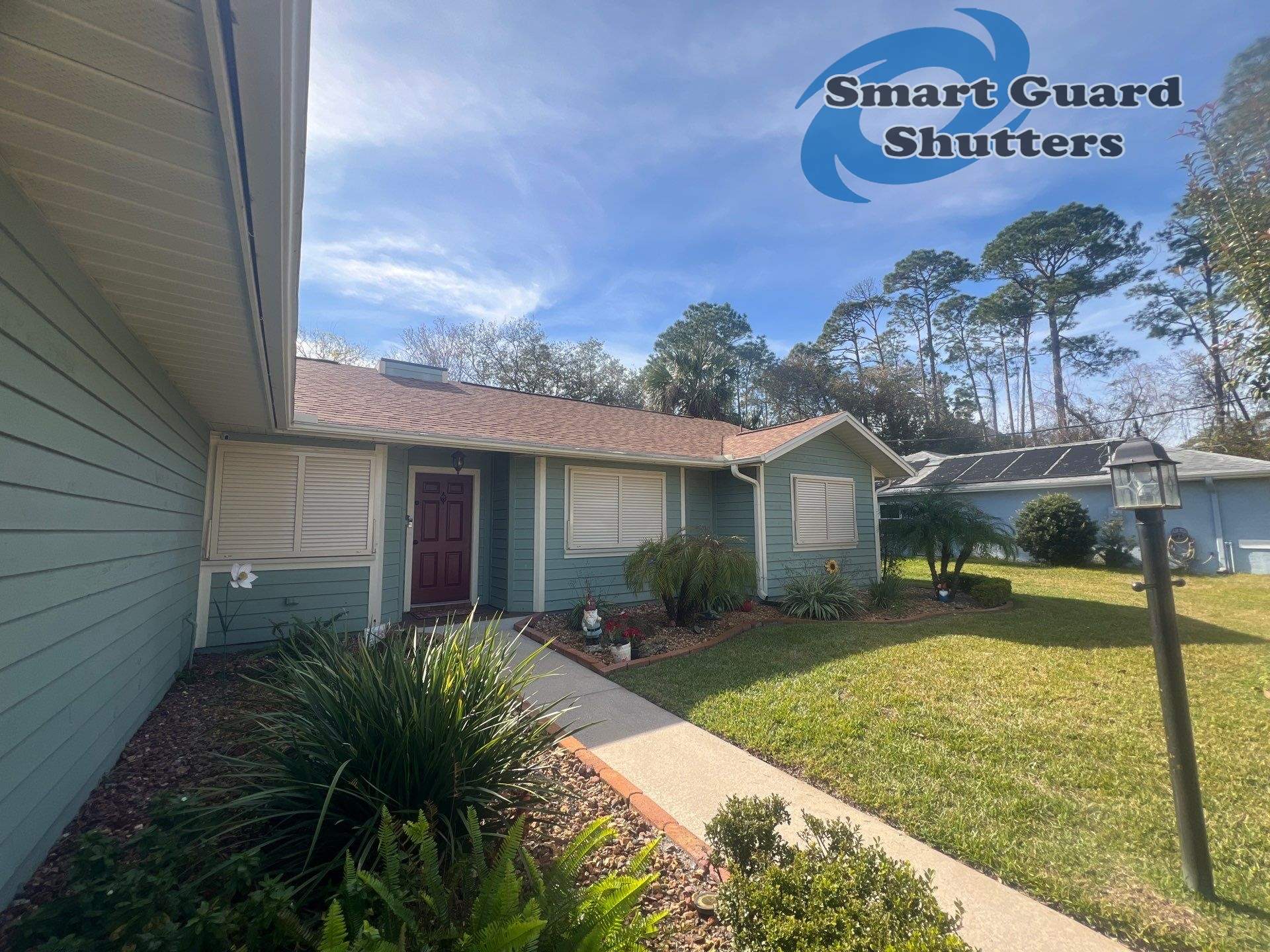 Impact Bahama Shutters in Light Ivory by Smart Guard Shutters