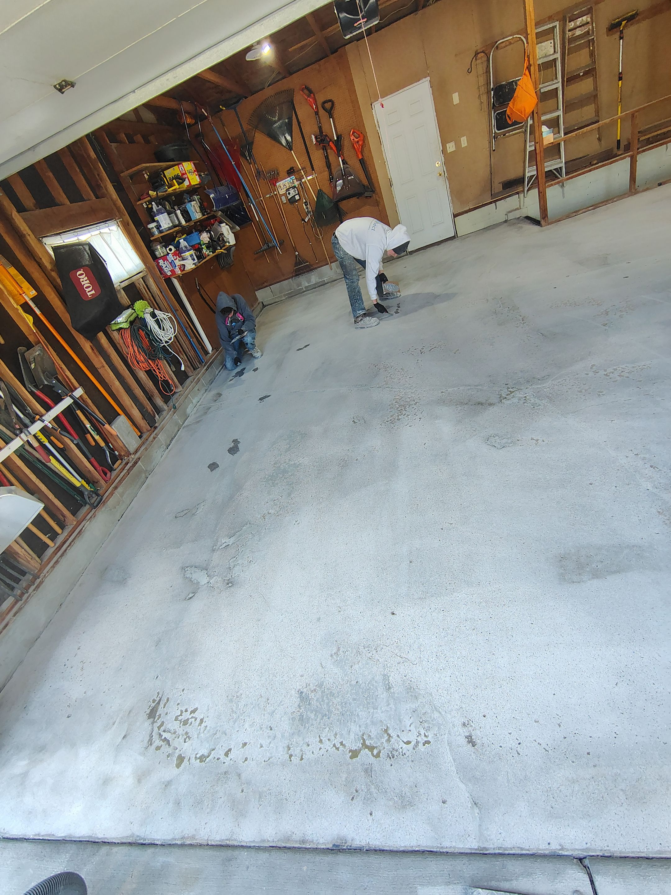 Sioux Falls Garage Epoxy Floor Installation and Concrete Crack Repair by Select Painting, Coatings & Garage Cabinets
