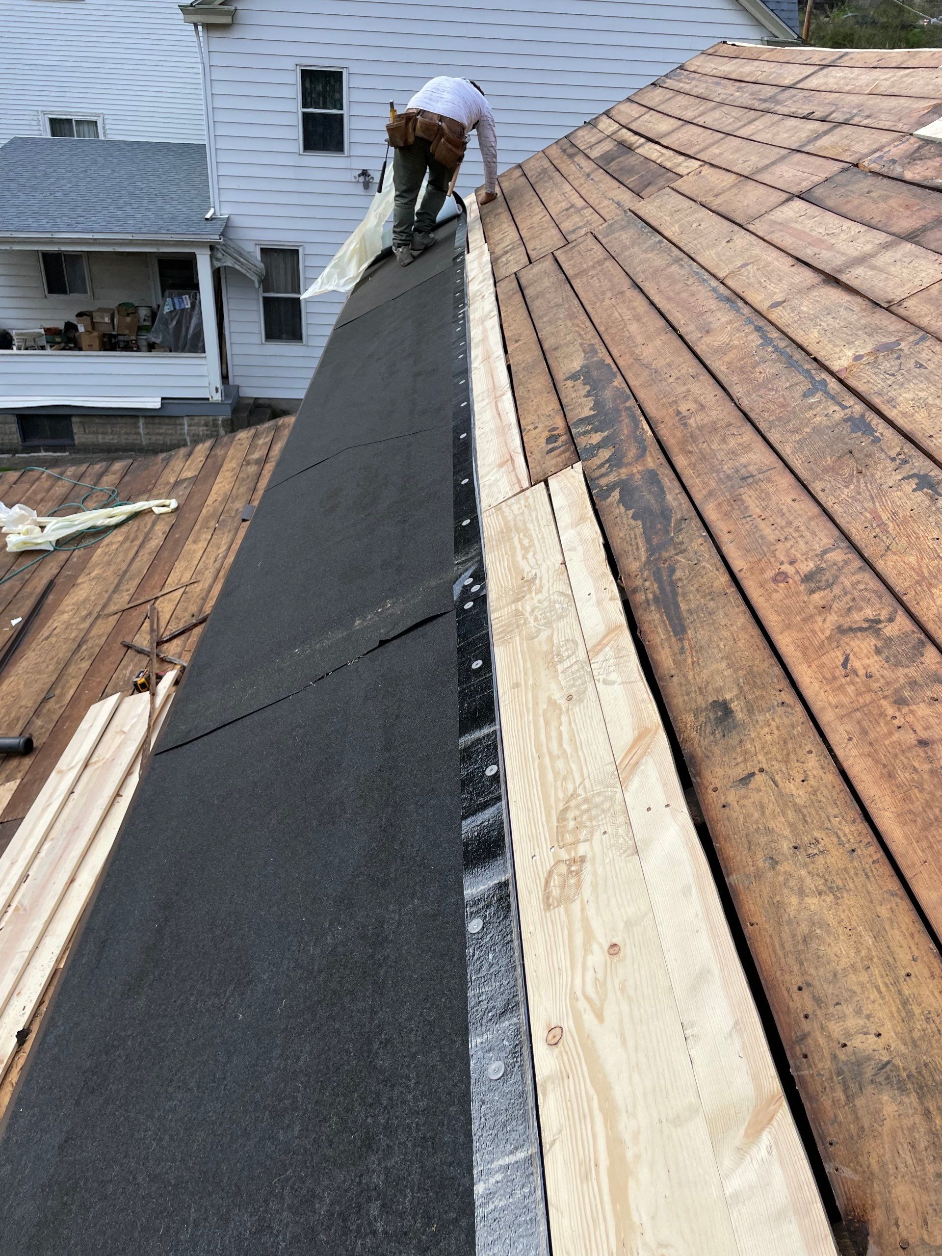 Roof sunspace deck  by Cousins Roofing Siding & Decks