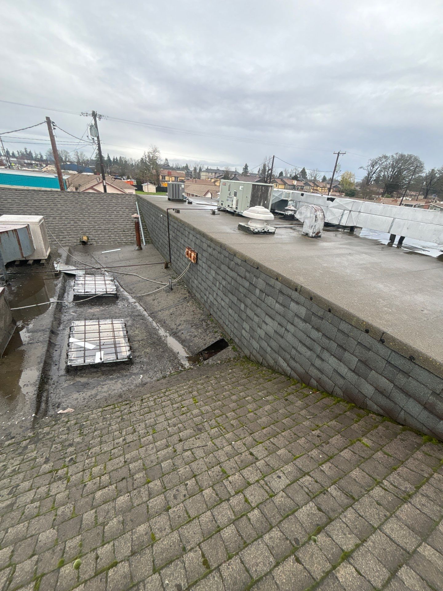 Summit Grey Lum Yun Salem Oregon Commercial Roof by Orezona Building & Roofing Company, Inc.