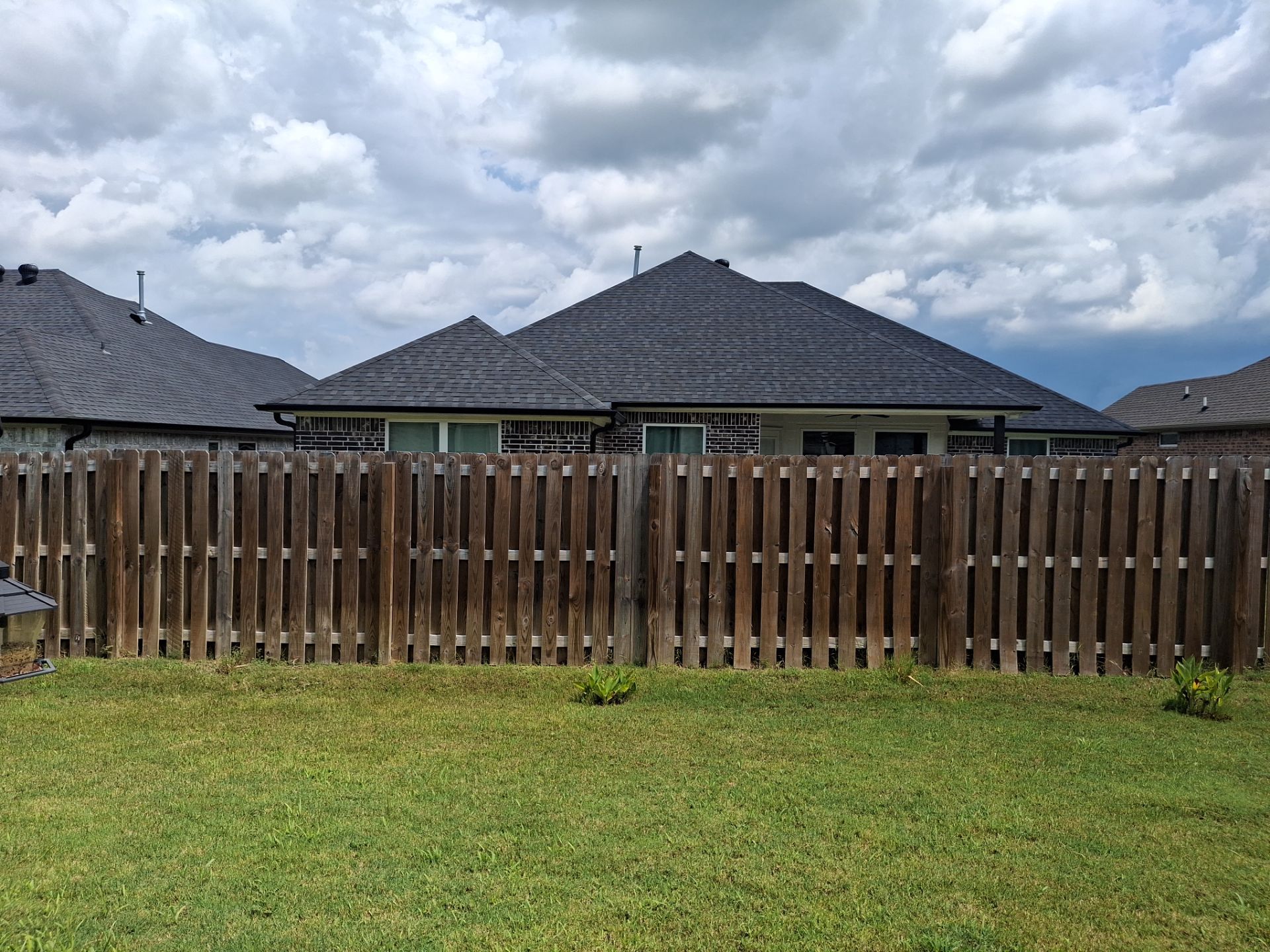 Touching Up a Fence in Whitehouse by Quality Coats Painting